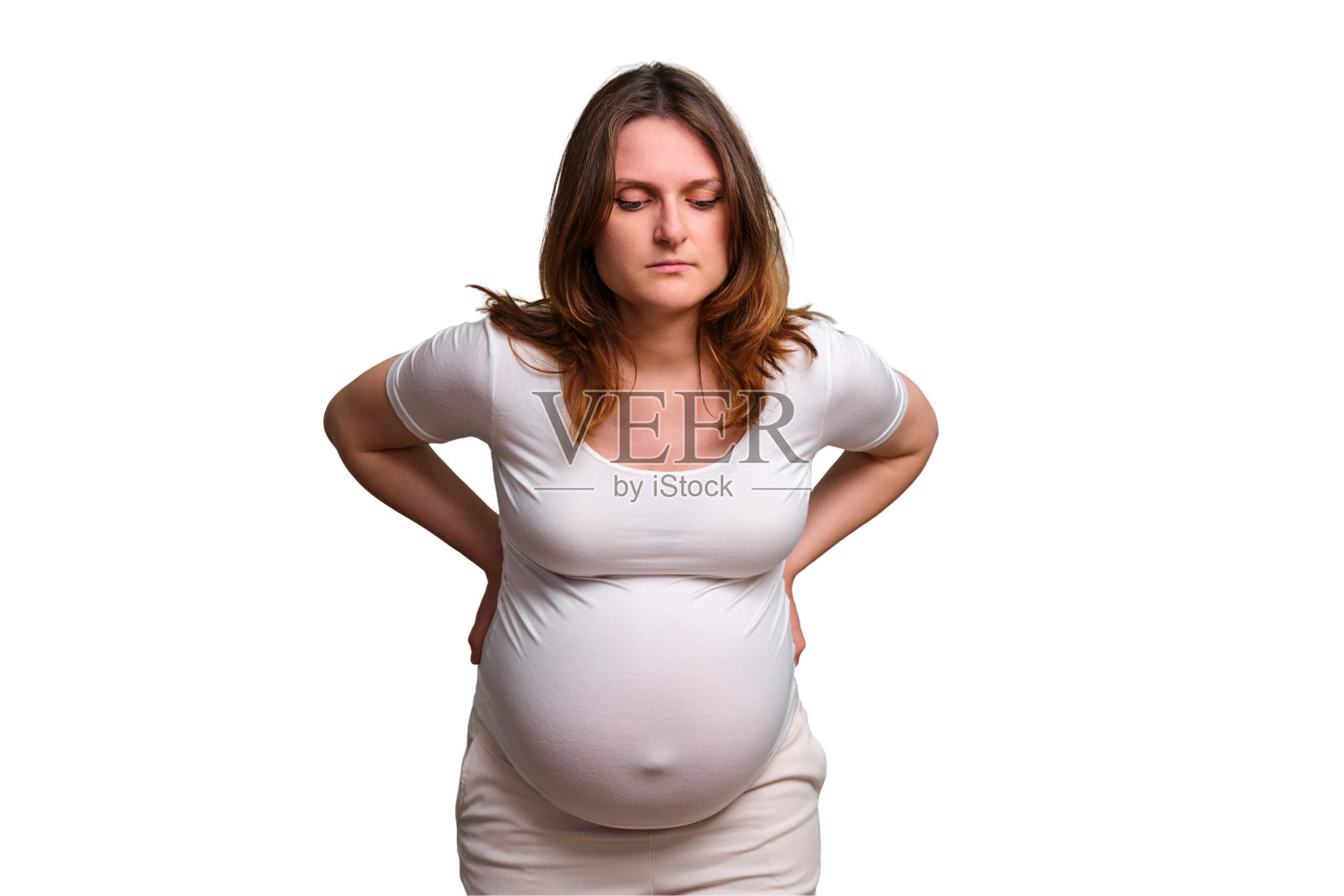 妇女怀孕期间的背痛问题,演播室白色背景照片摄影图片