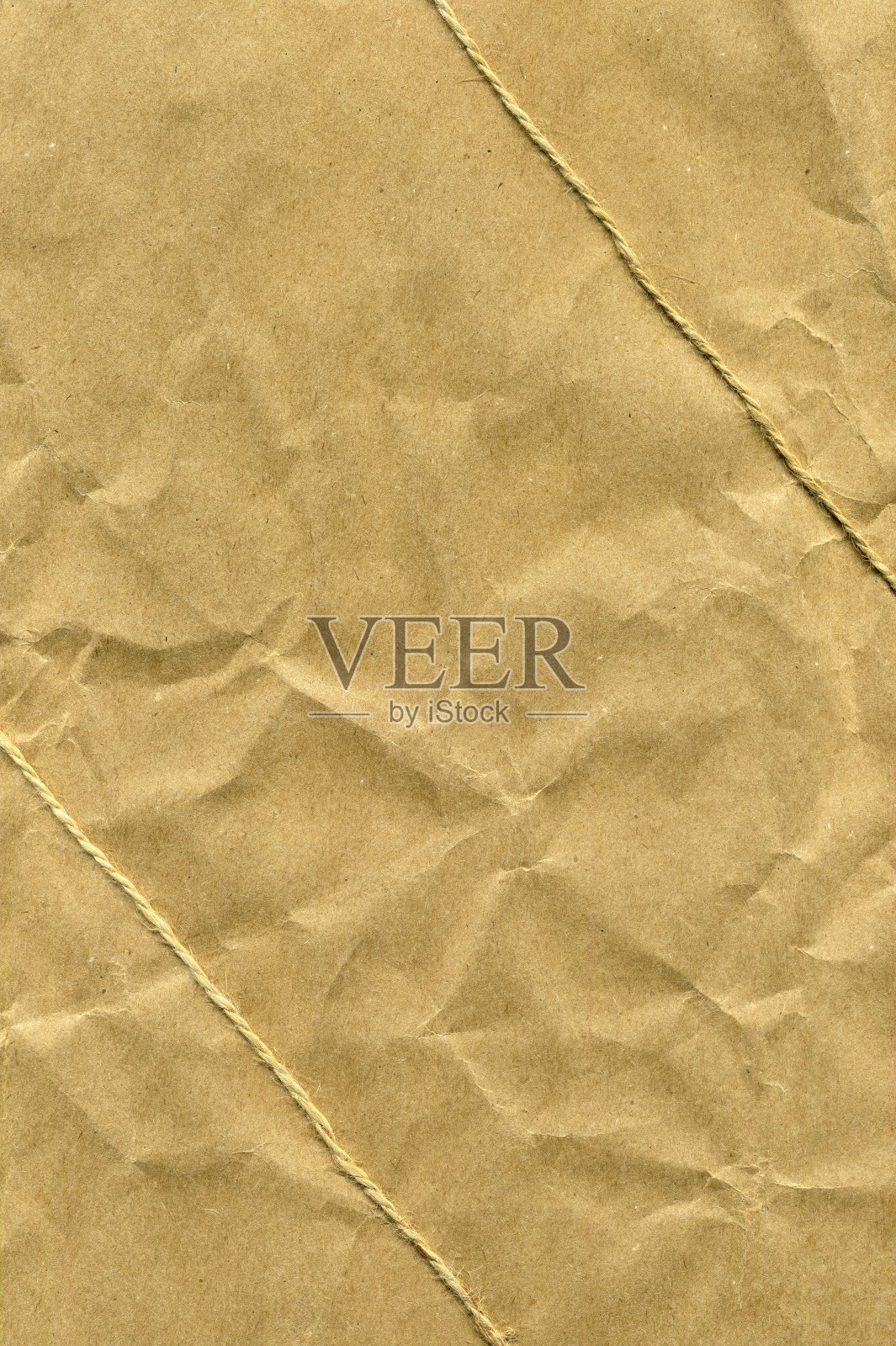 一种旧的粗糙的包装纸,用捆扎成斜线作为抽象的背景照片摄影图片