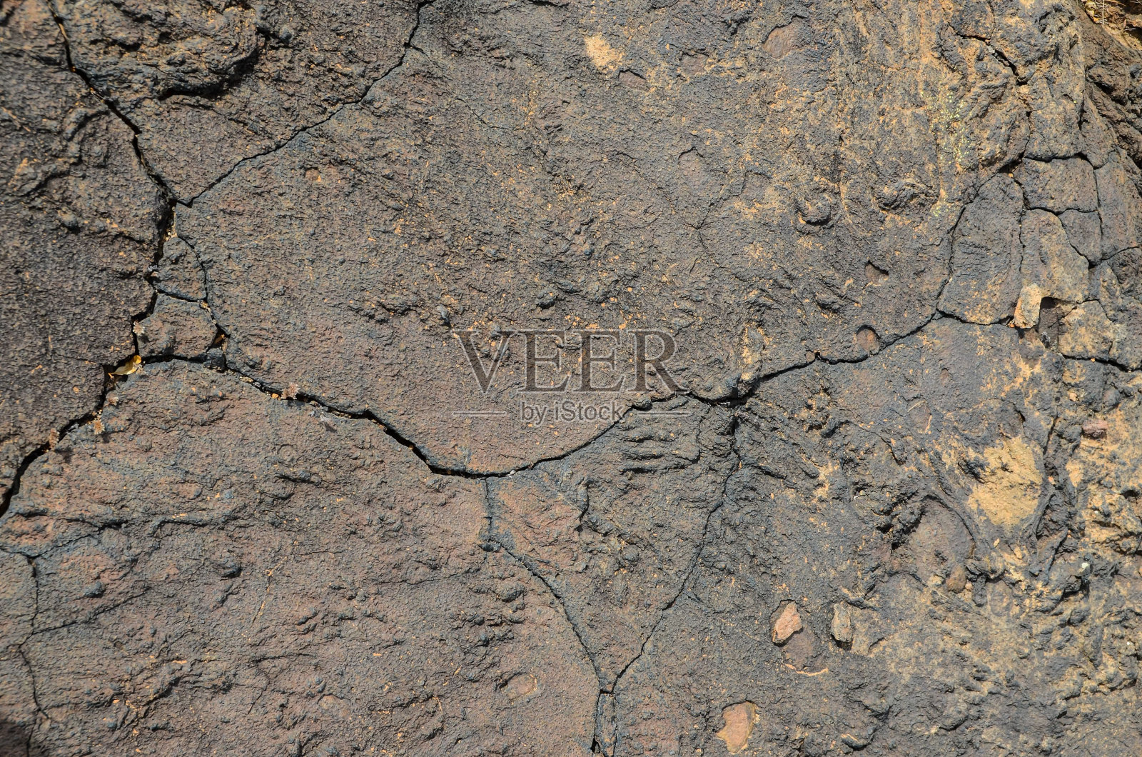 火山干燥的棕色熔岩纹理特写。自然背景。加那利群岛。照片摄影图片