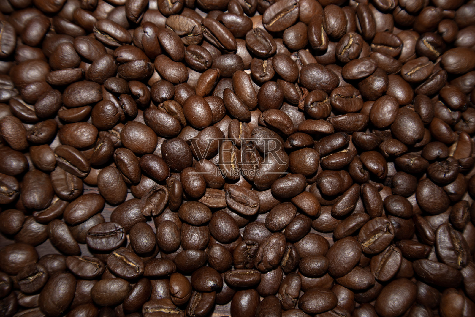 烘焙咖啡豆。咖啡背景或纹理概念。照片摄影图片