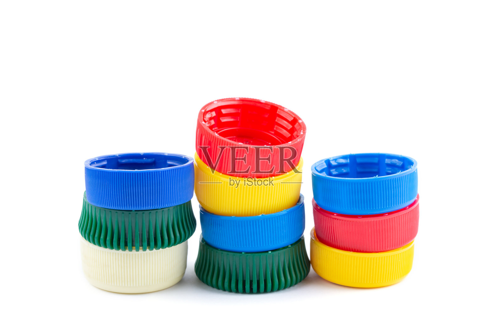 不同颜色的瓶盖,回收利用的绝佳原料。照片摄影图片