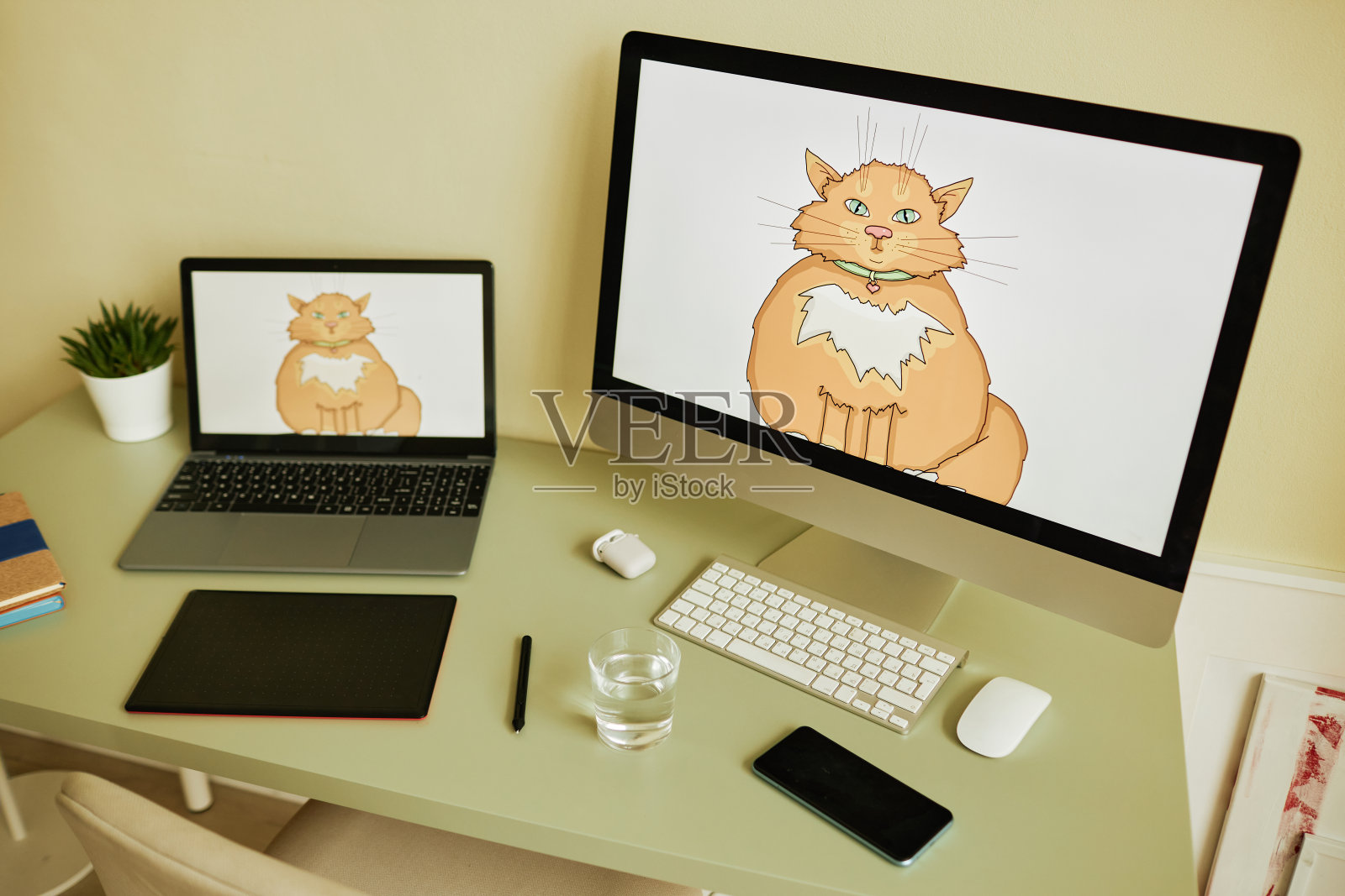 平面艺术家的工作场所与电脑显示器和移动设备照片摄影图片