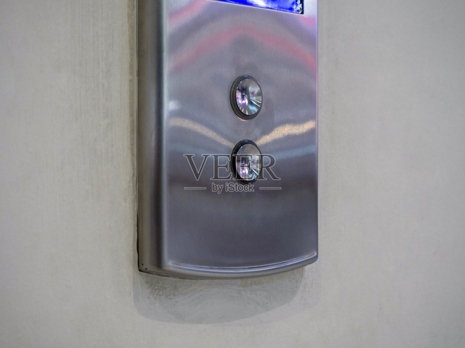 面板按钮呼叫电梯。照片摄影图片