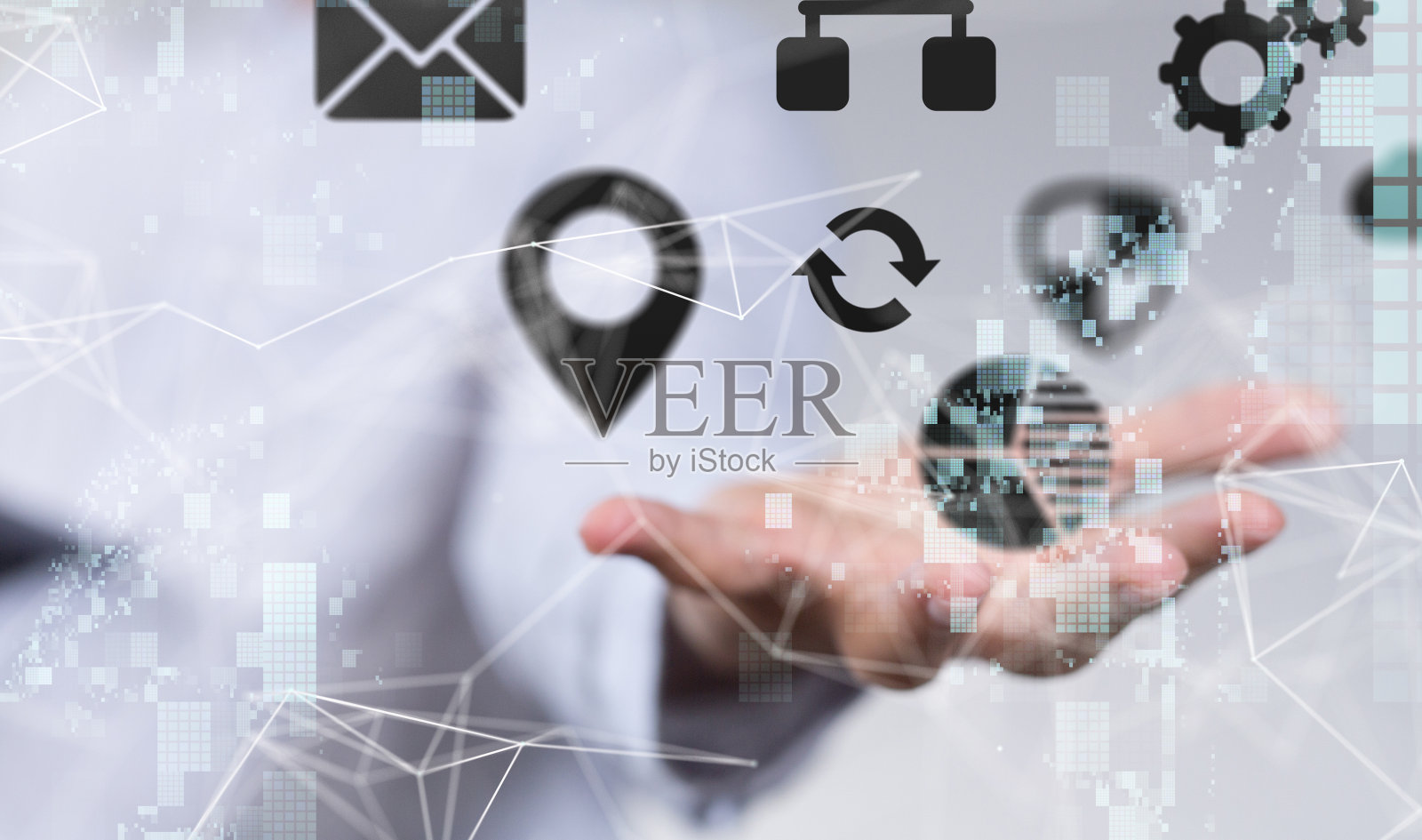 一个男人手掌上各种电脑和手机图标的全息图照片摄影图片