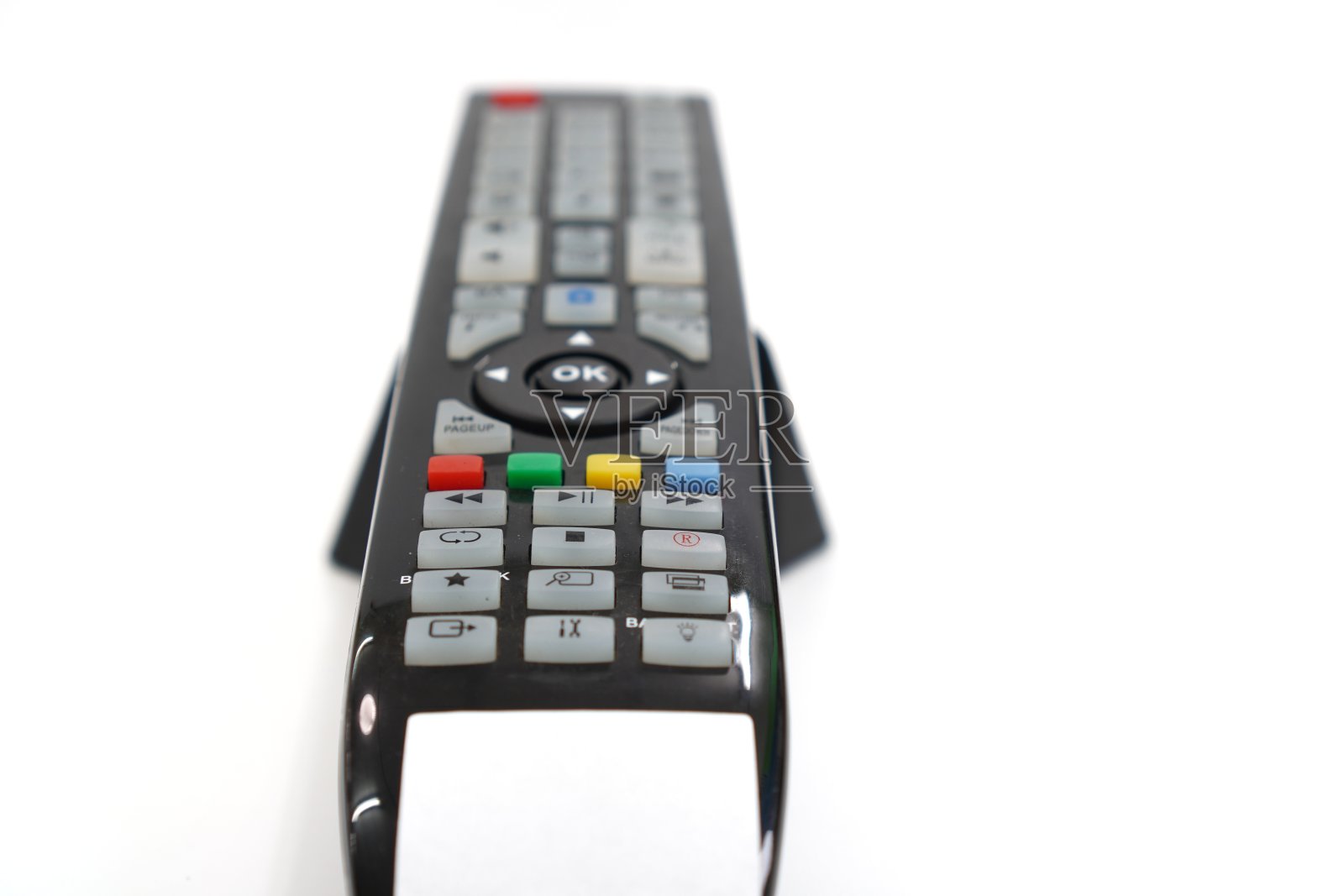 这张照片显示了一个白色背景的经典电视遥控器,孤立的,近距离的。照片摄影图片