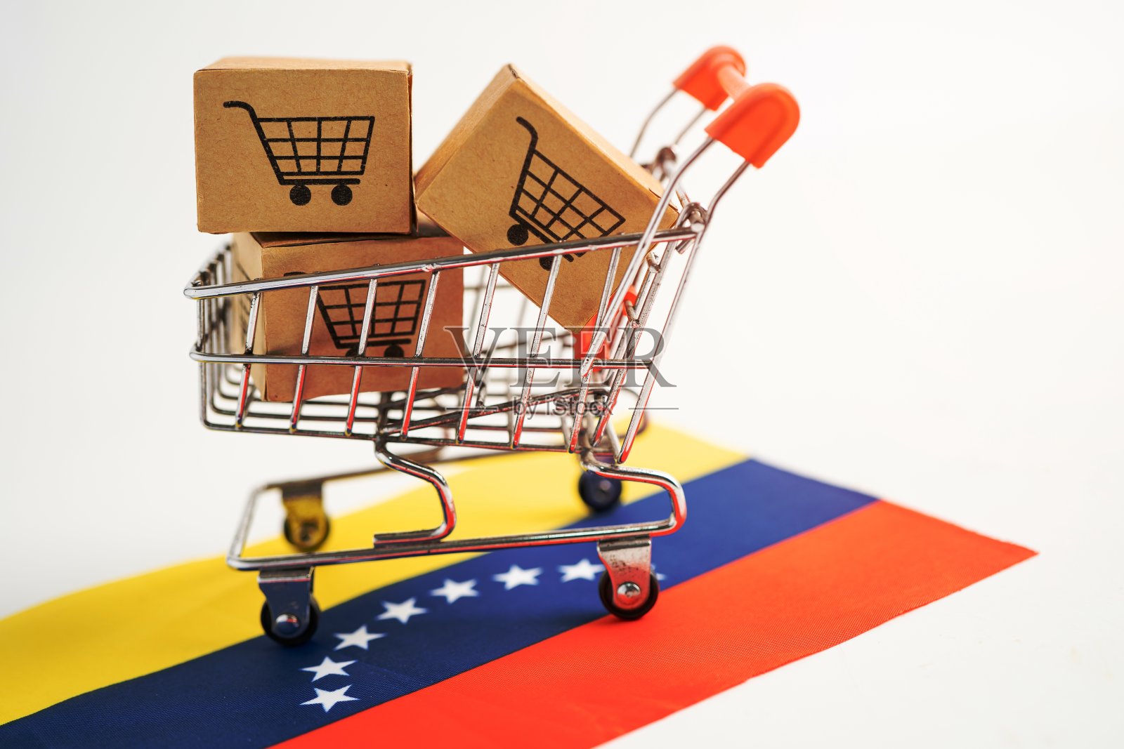 盒子购物车标志和委内瑞拉国旗,进出口网上购物或电子商务金融交付服务商店产品航运,贸易,供应商概念。照片摄影图片