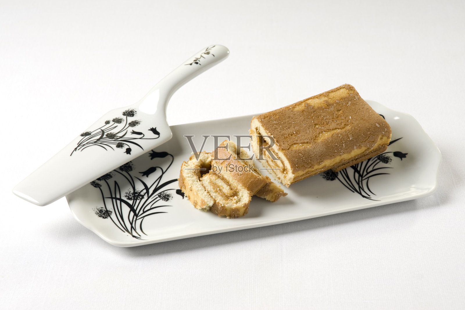 长方形蛋糕盘和蛋糕铲,用卷饼,孤立照片摄影图片
