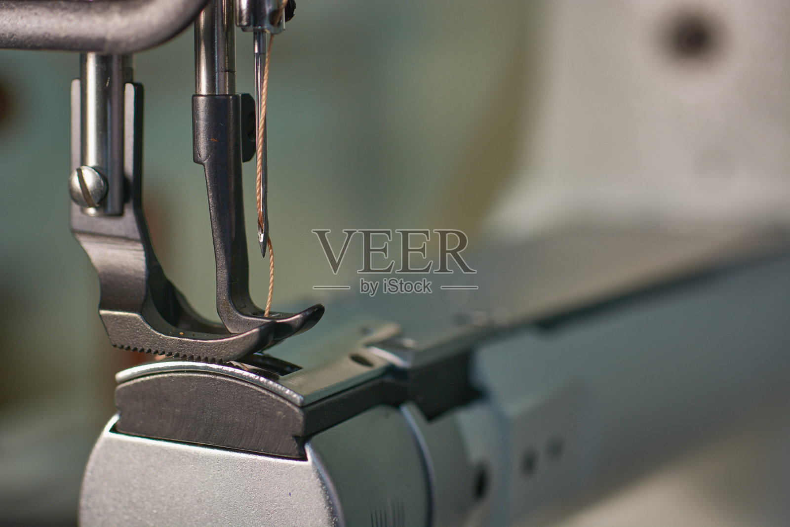 浇重料的缝纫机照片摄影图片