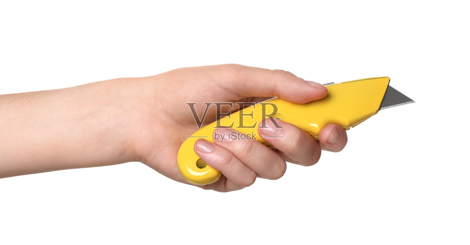 白色背景的女人拿着美工刀,特写照片摄影图片