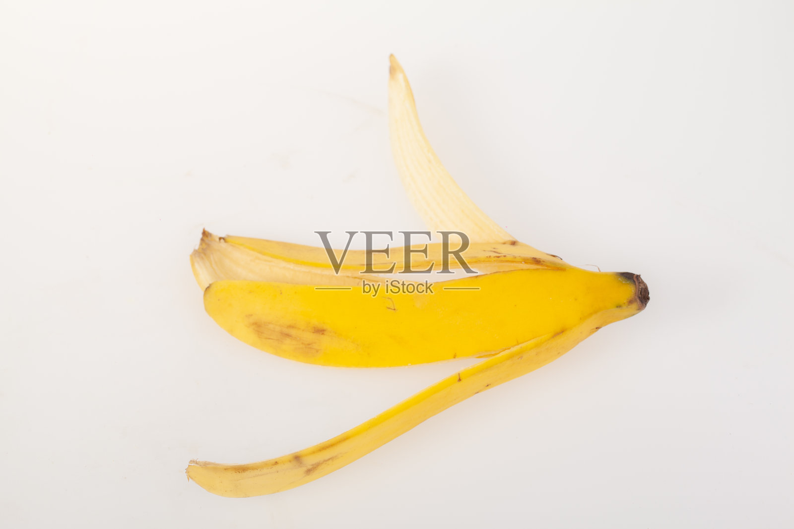 成熟的香蕉皮孤立在白色背景上照片摄影图片