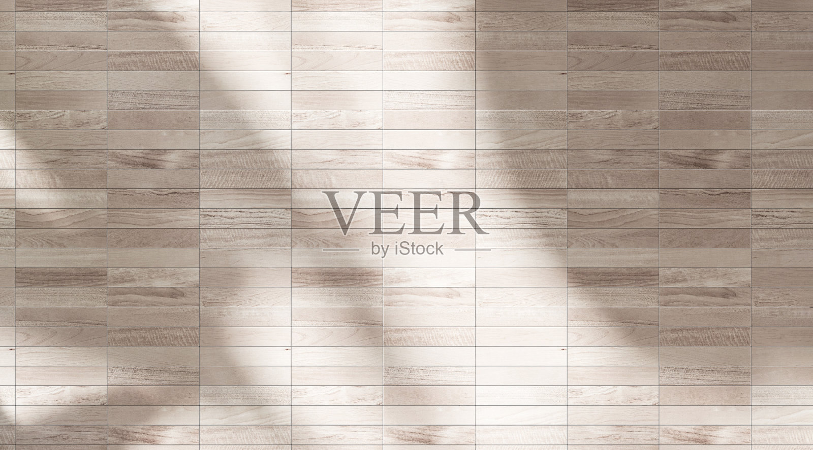 柔软而美丽的热带香蕉叶阴影在米黄色木纹纹理瓷砖墙背景照片摄影图片