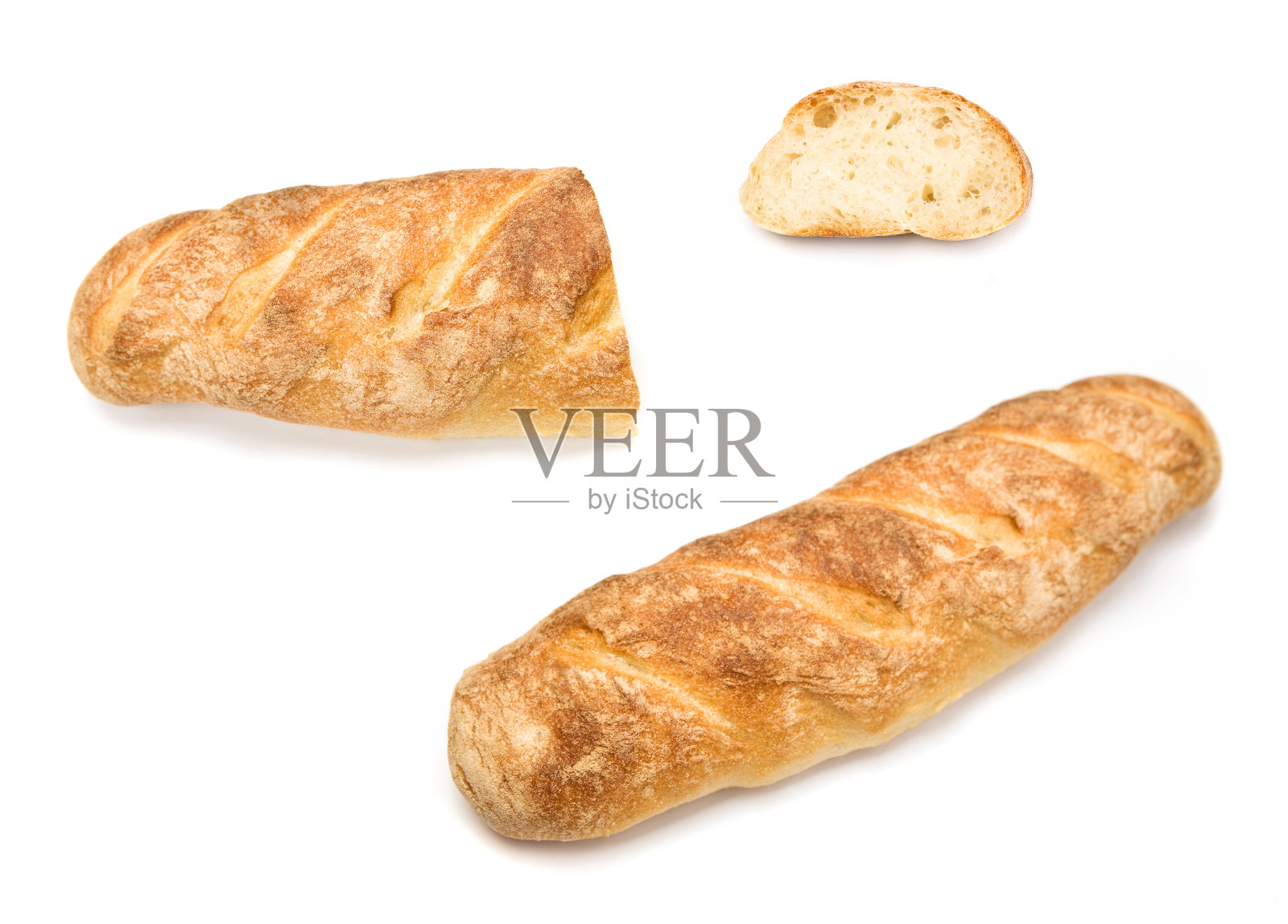 自制的法式长面包,有一部分和一片放在一边照片摄影图片