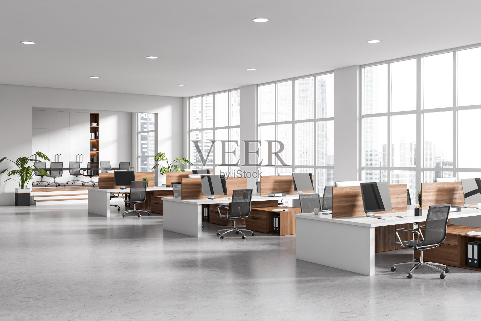 角落视图明亮的办公室内部与电脑照片摄影图片