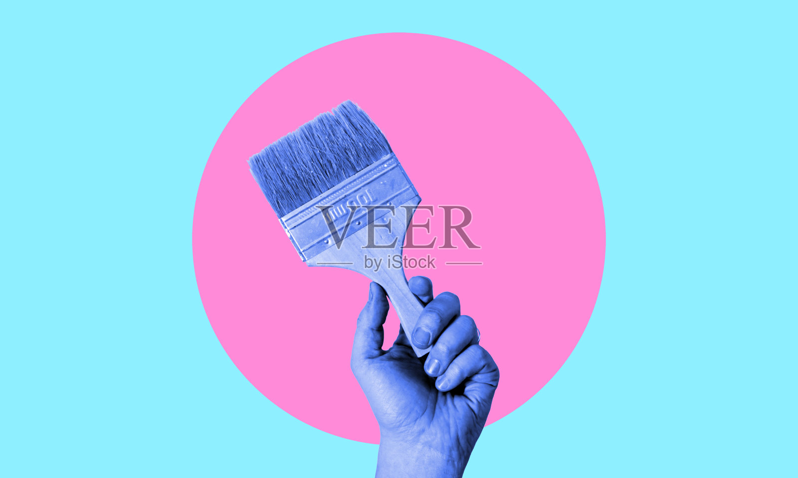 当代艺术拼贴画,描绘一只手拿着画笔在墙上作画。照片摄影图片