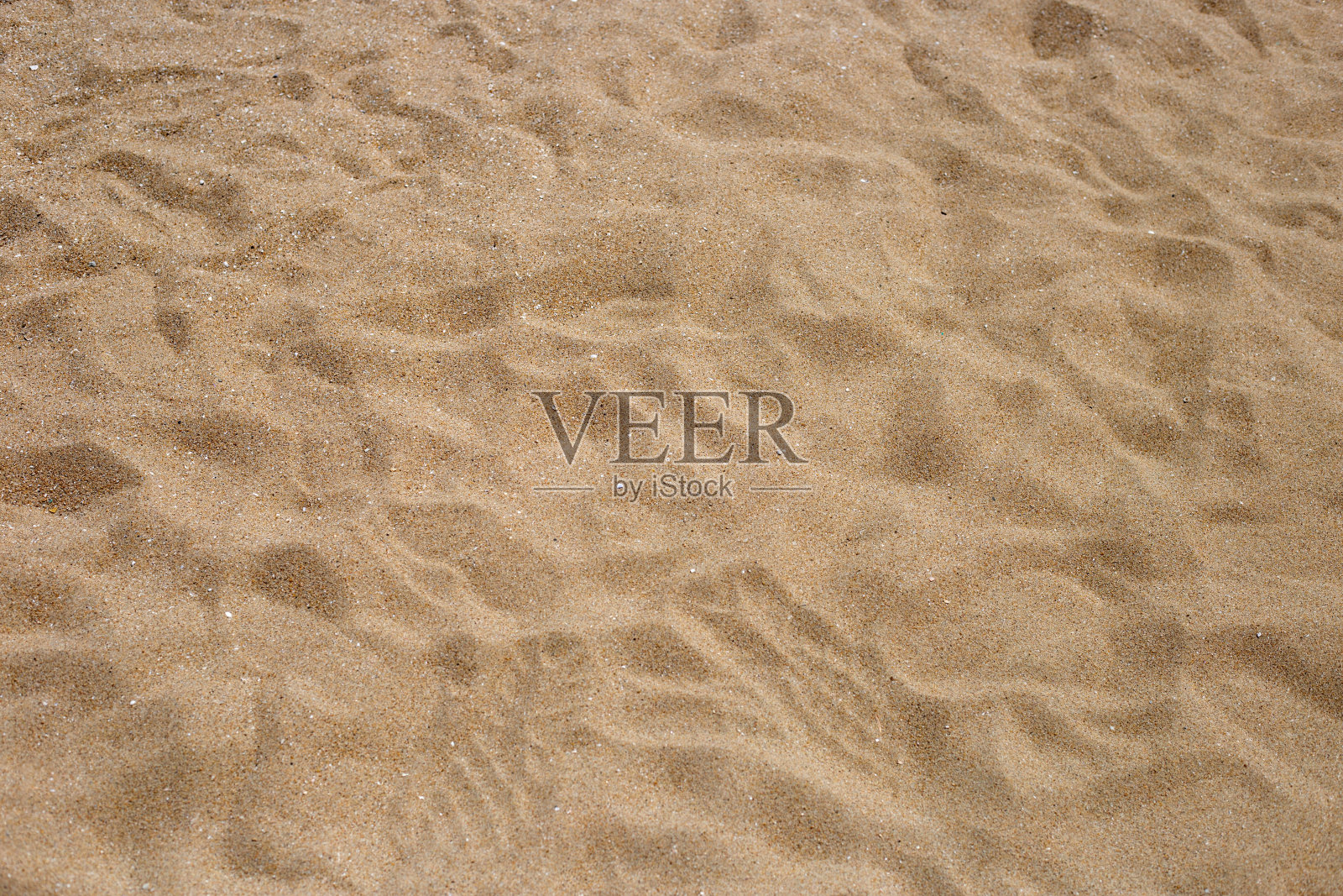 沙滩沙子纹理为背景。照片摄影图片