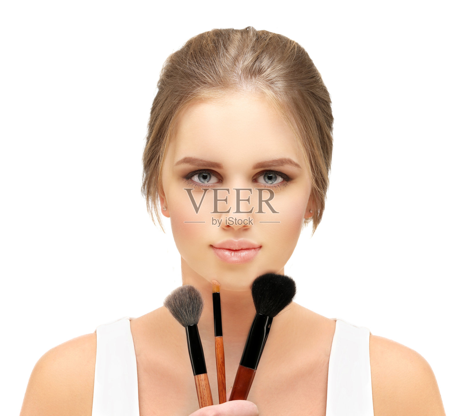 化妆。拿着化妆刷的女人照片摄影图片