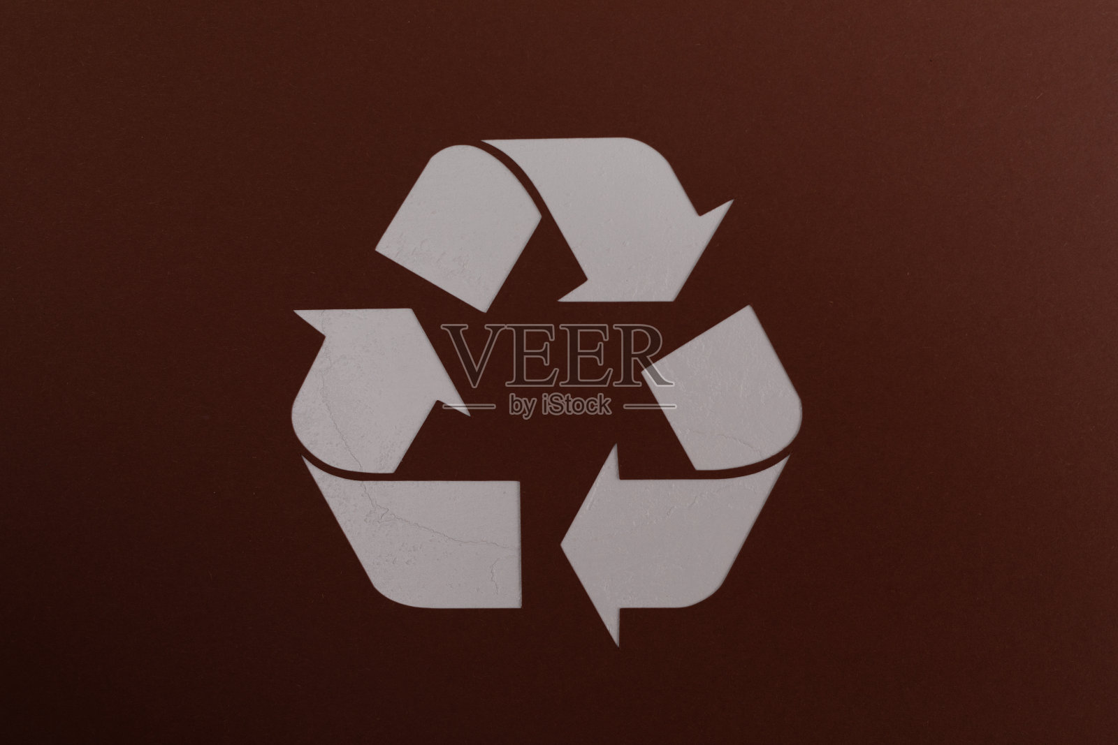 棕色背景上的回收符号照片摄影图片