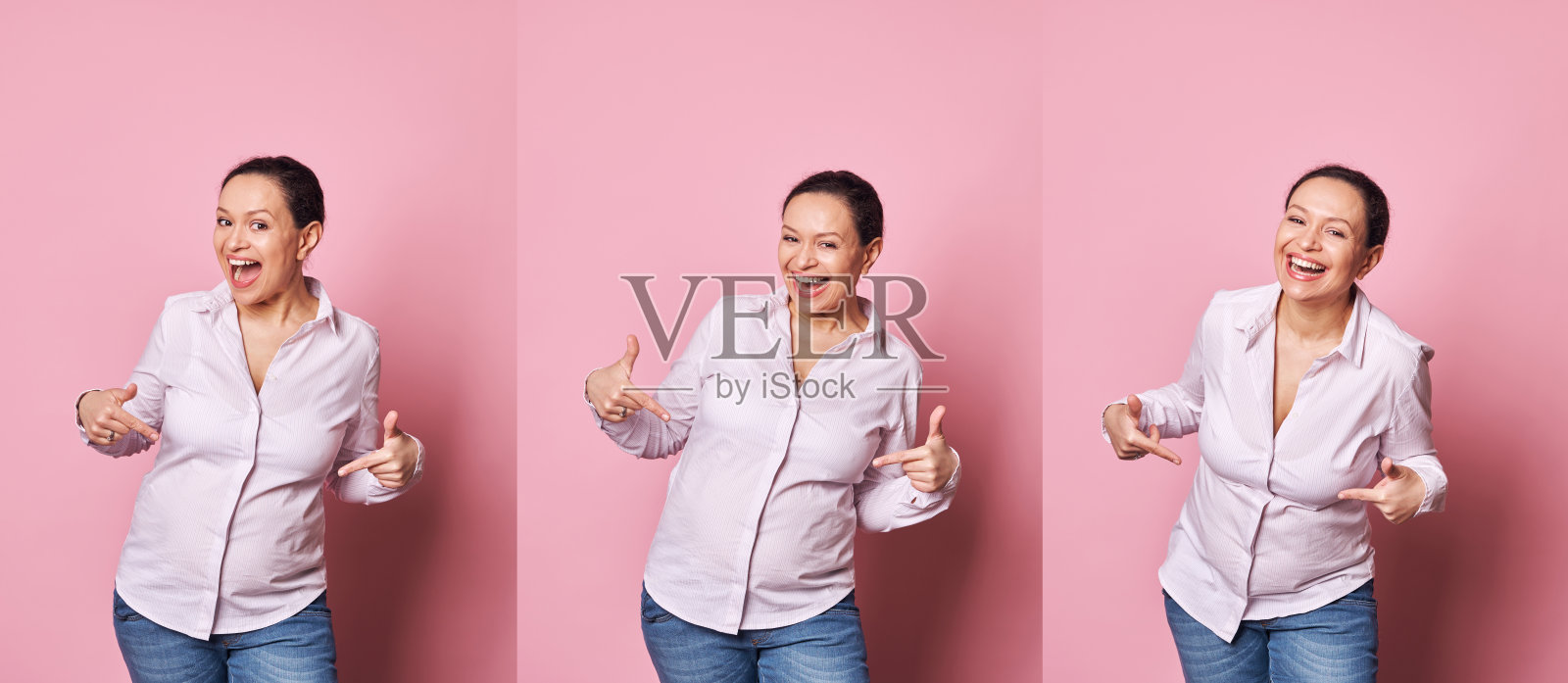 一名孕妇用手指着自己的肚子,表达自己第一次感受到宝宝踢她的喜悦和兴奋照片摄影图片