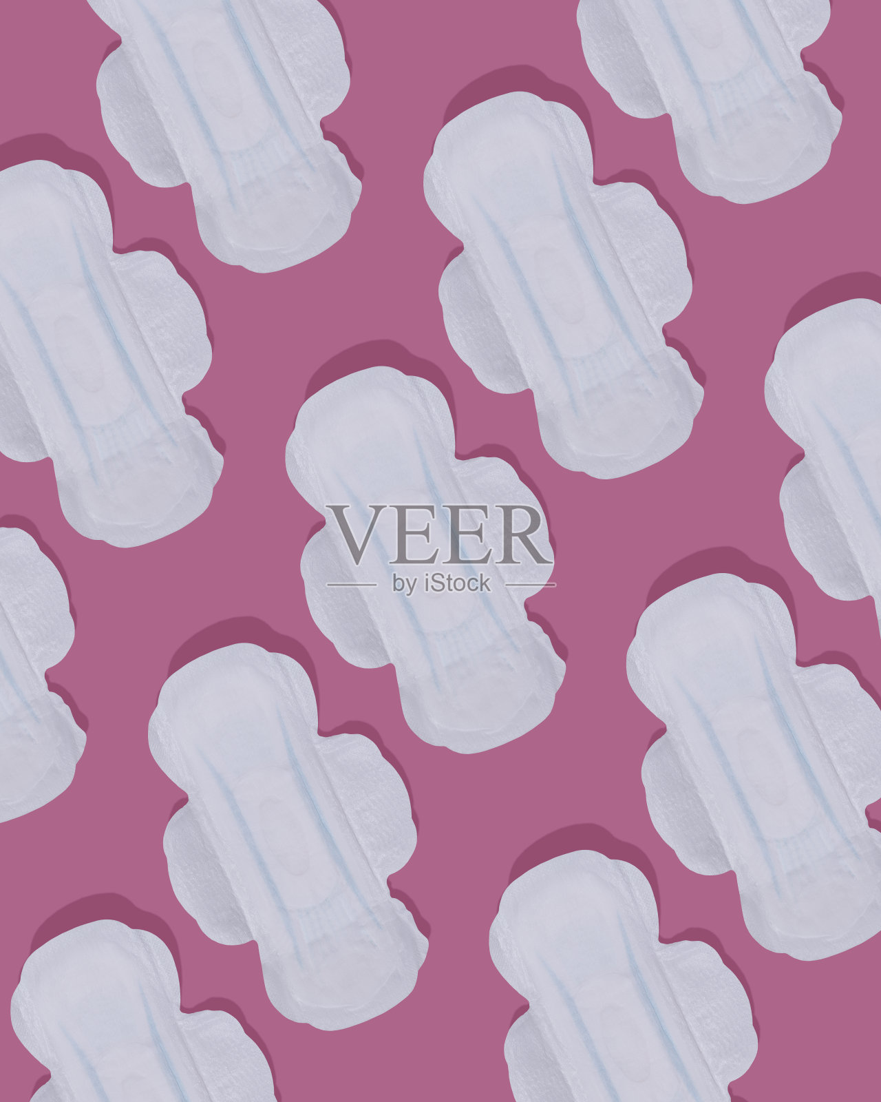 许多新开的白色卫生巾在粉红色的背景上。模式。女性卫生。照片摄影图片