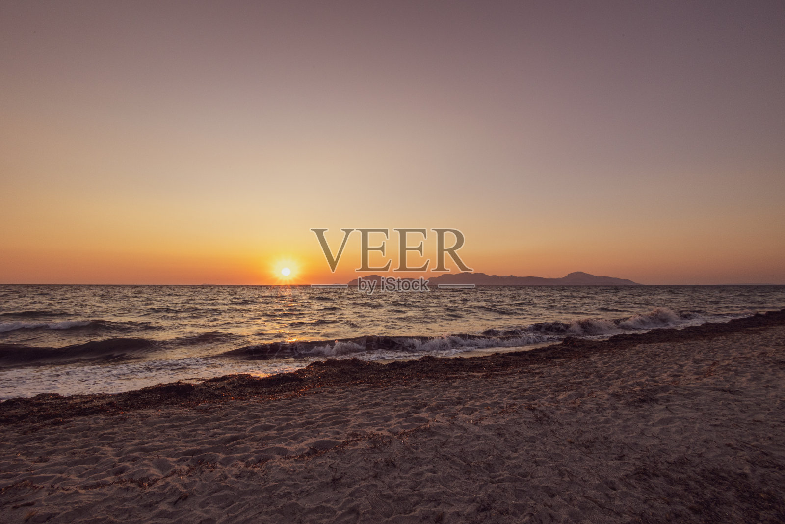 科斯海滩的日落照片摄影图片