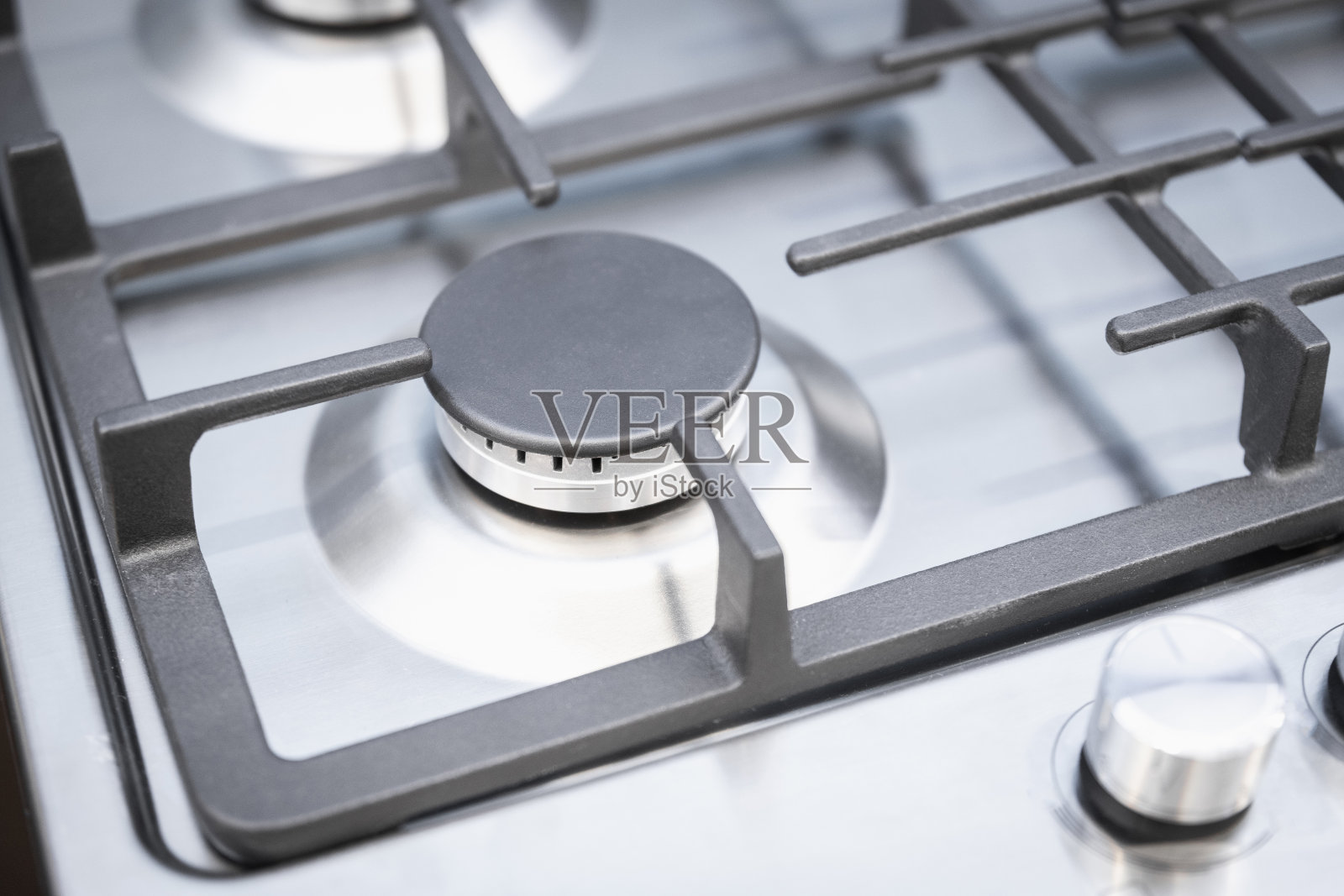 一个新燃气灶的燃烧器特写照片摄影图片