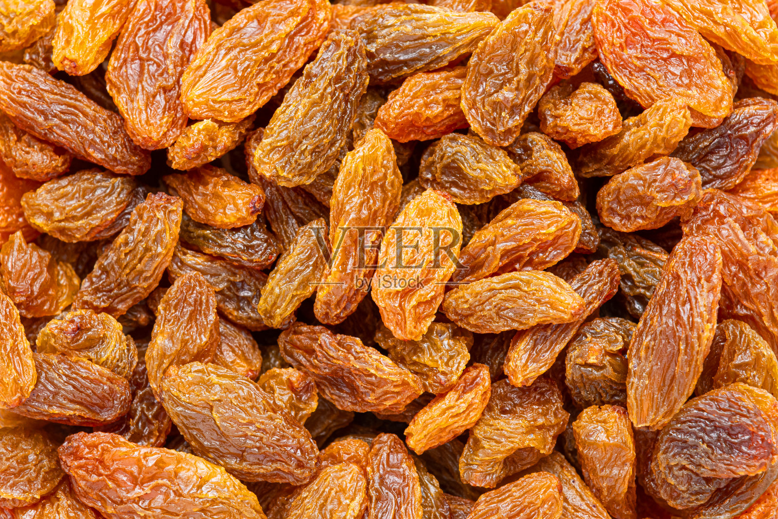 特写甜黄葡萄干的背景。照片摄影图片