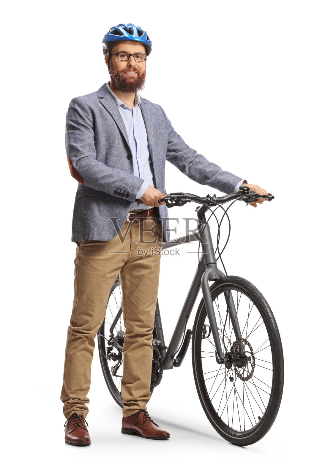 戴着头盔的大胡子男子站在一辆自行车旁,面带微笑照片摄影图片