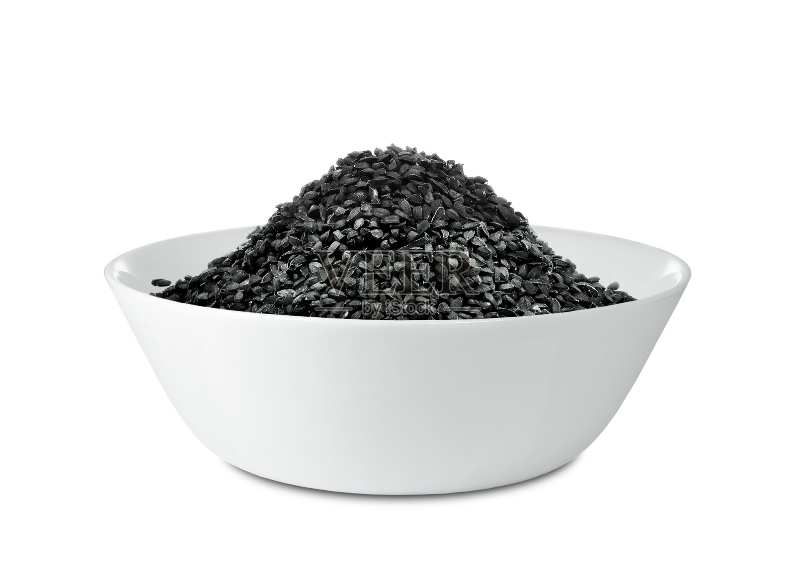 黑孜然籽放入碗中照片摄影图片