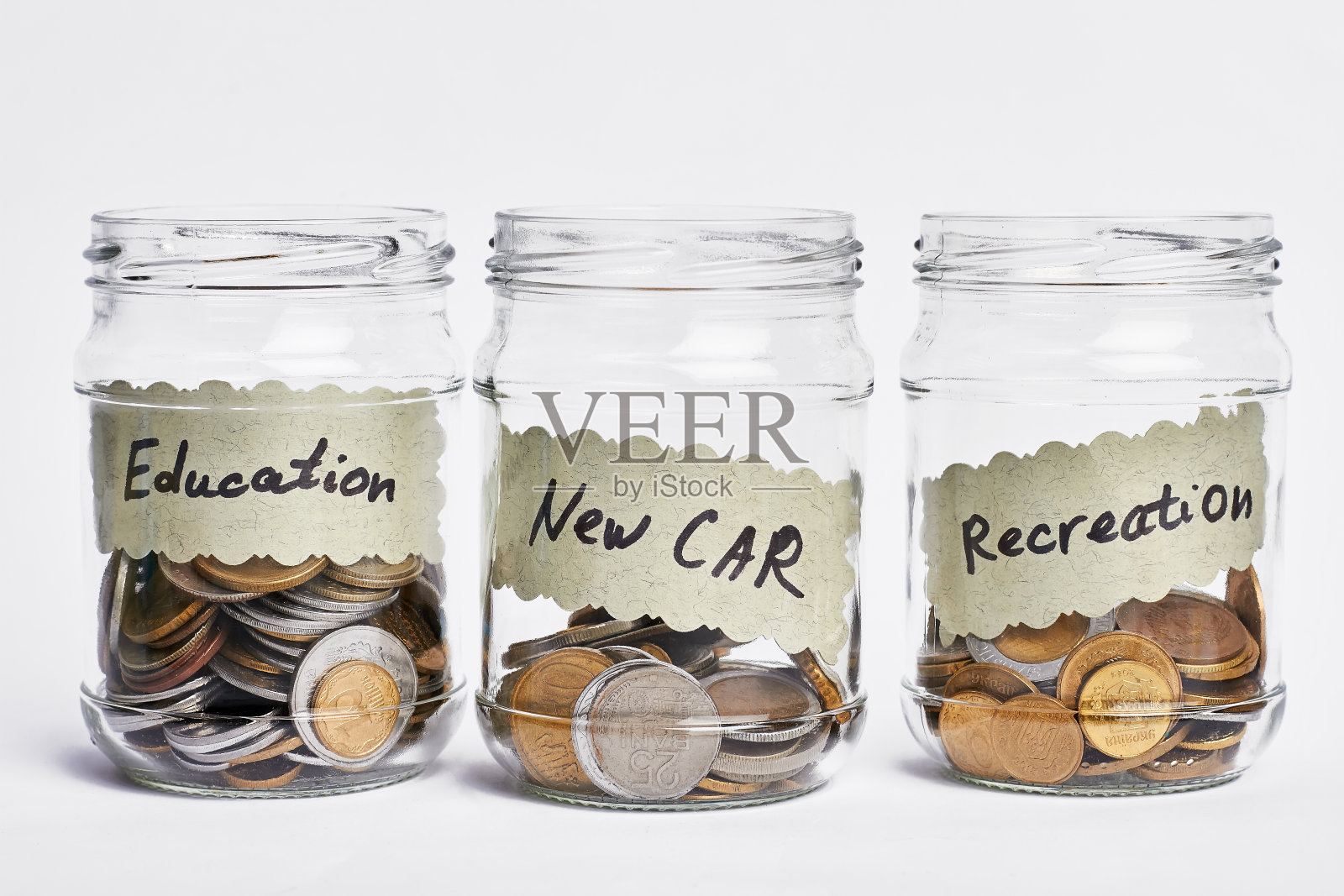 成功的硬币罐。照片摄影图片