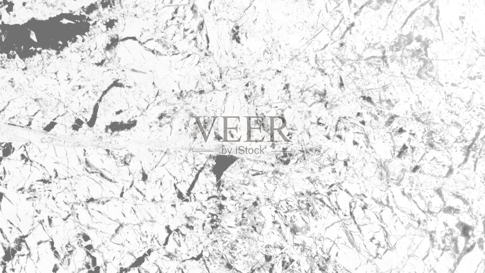 大理石白色和灰色大理石背景室内装修材料,如地板,墙壁,柜台。白色大理石背景的特写与灰色质朴的矿物脉图案形成强烈对比。照片摄影图片