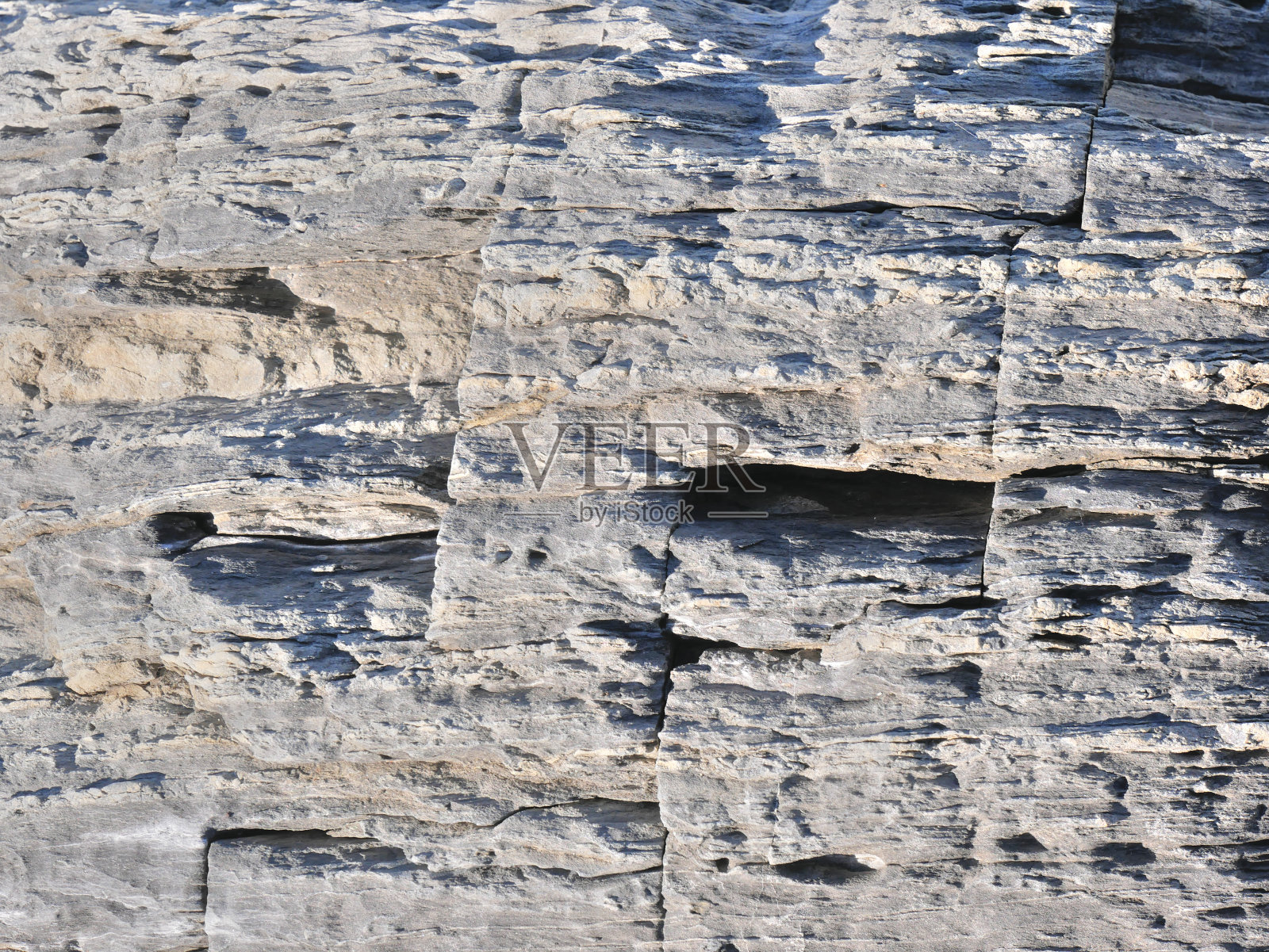 靠近有裂缝的岩石照片摄影图片