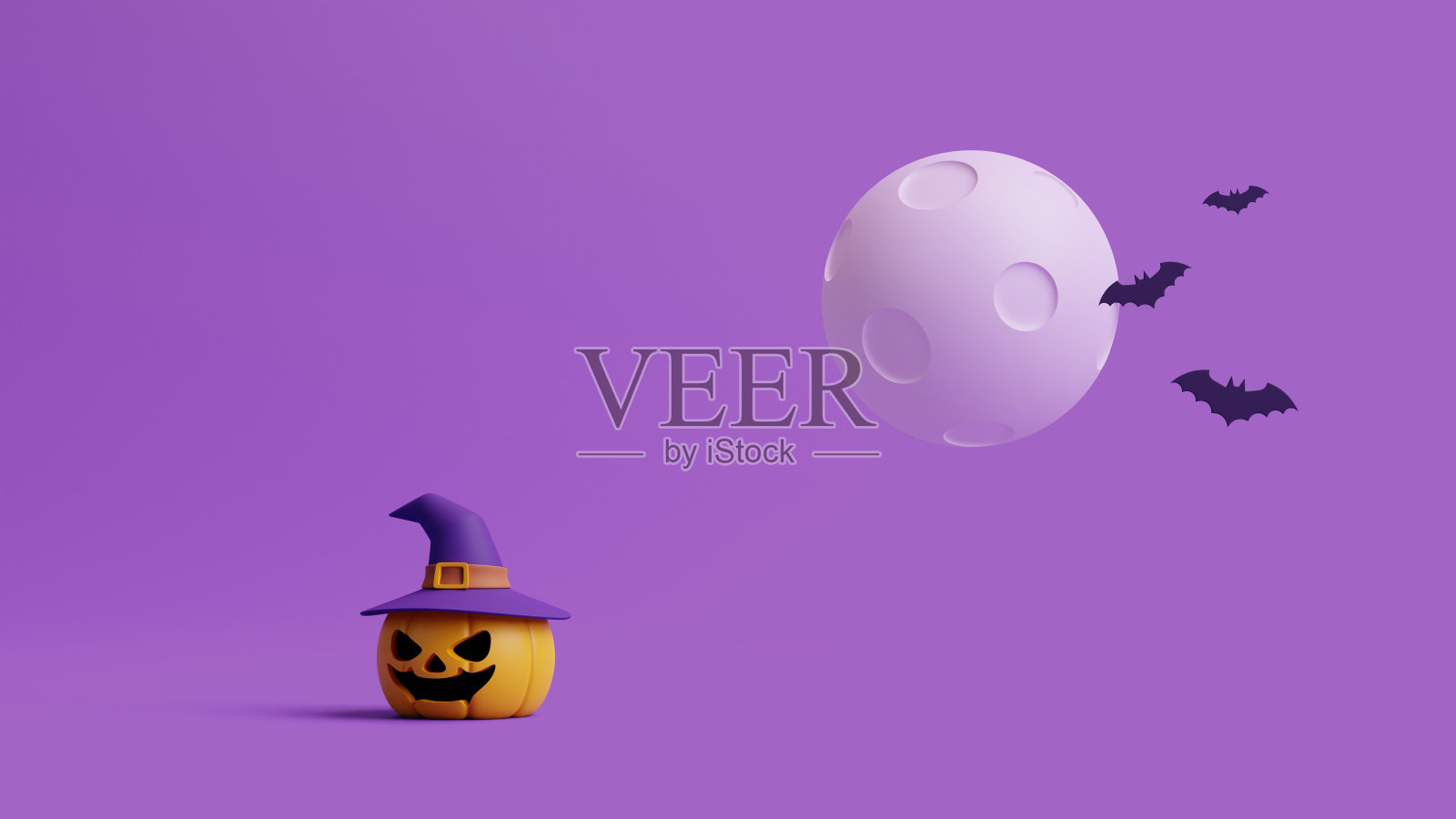 戴着女巫帽和蝙蝠的南瓜灯在紫色的月光下照片摄影图片