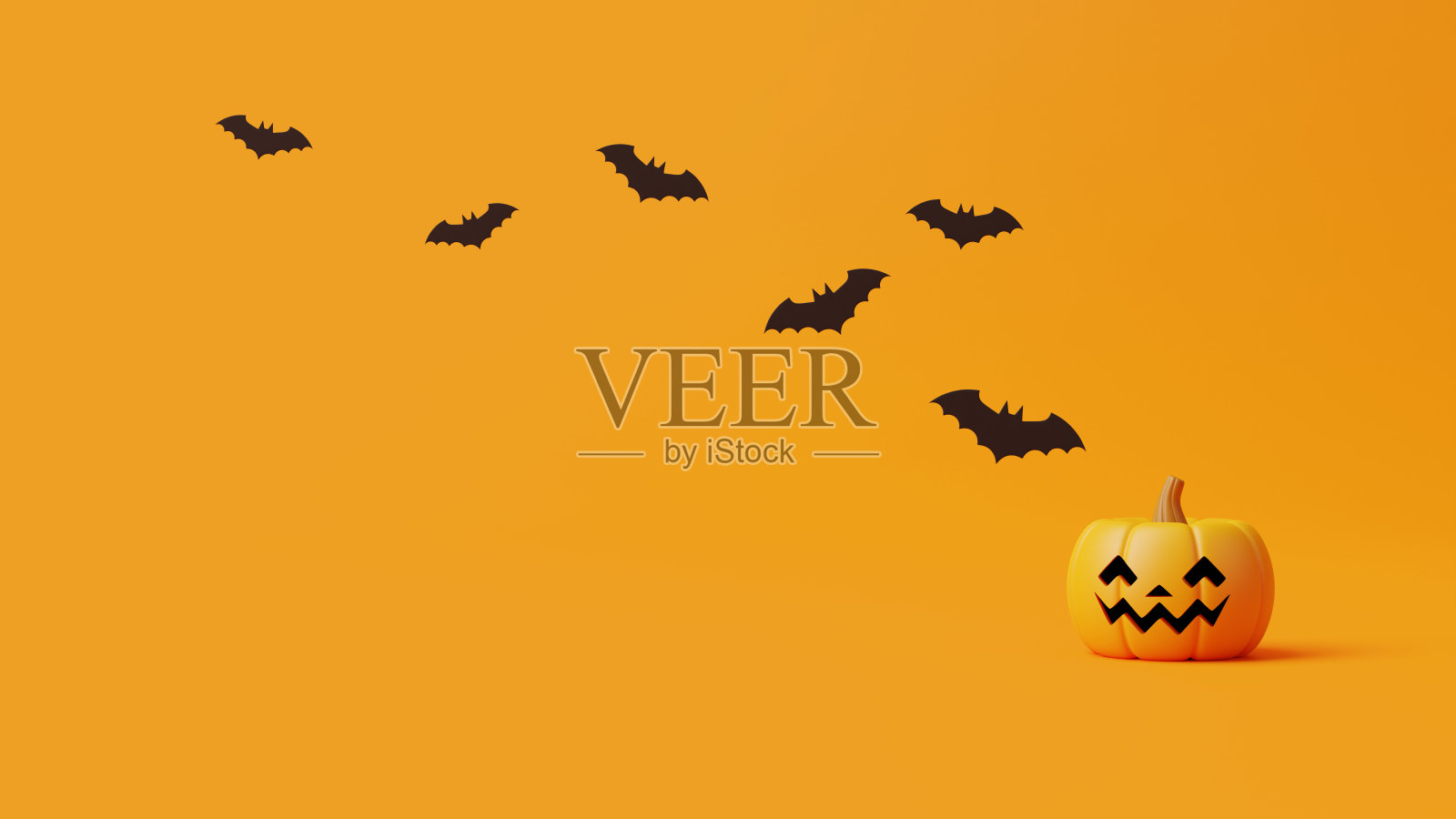 橙色背景上有蝙蝠的南瓜灯照片摄影图片