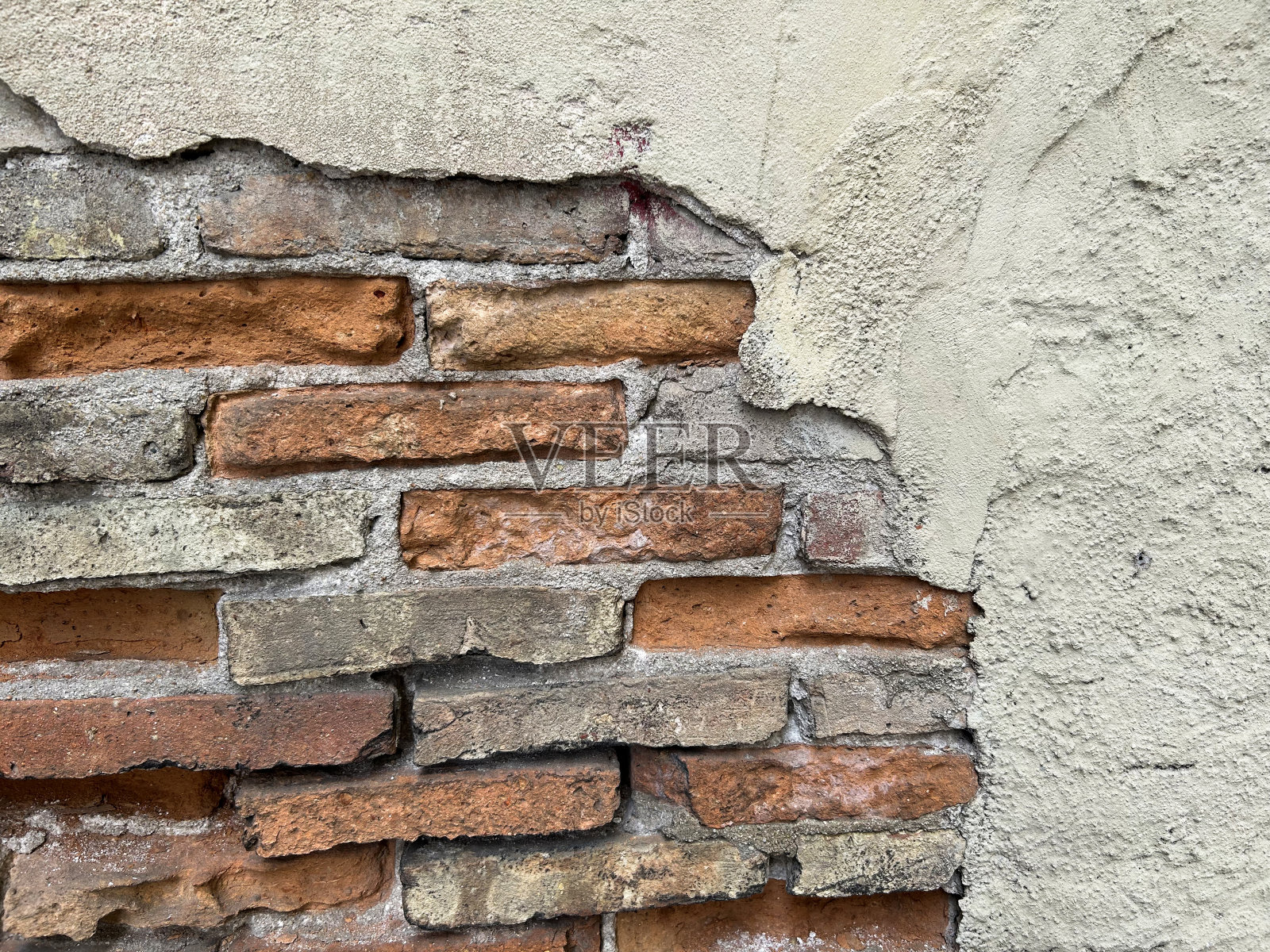 墙用红砖和灰色水泥。特写镜头。背景。照片摄影图片