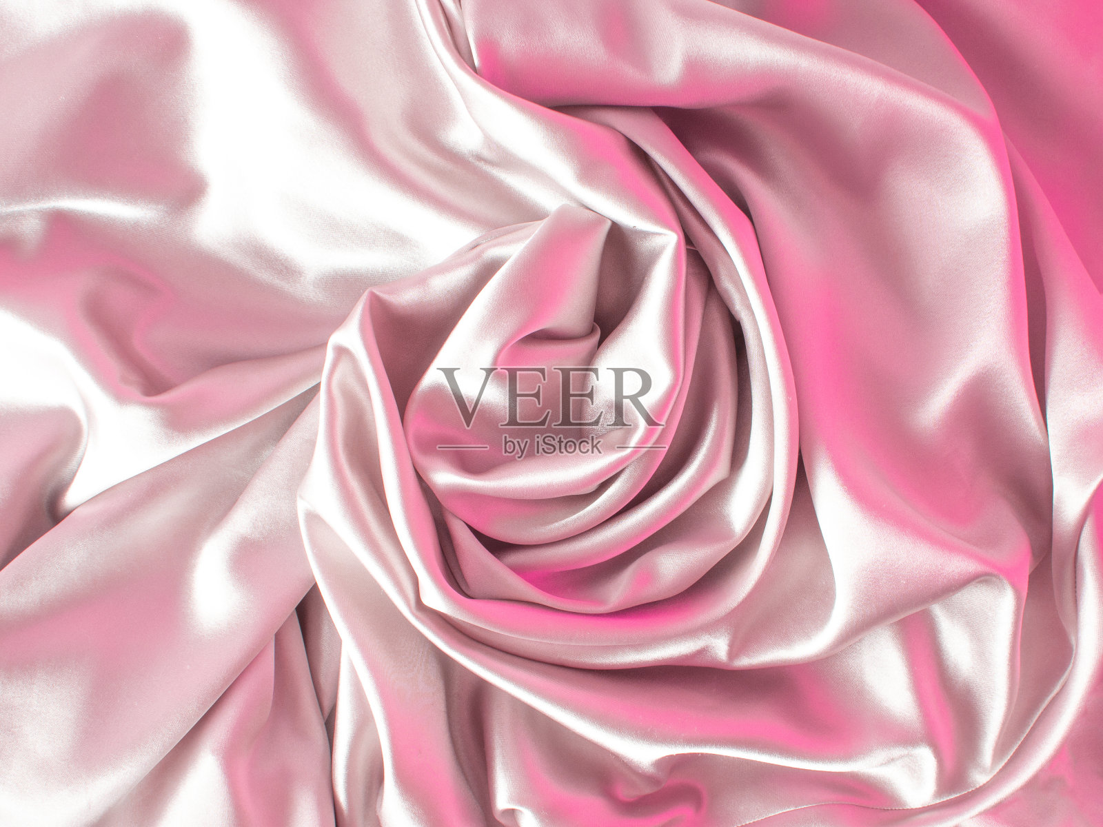 光滑优雅的金玫瑰丝或缎子可以用作婚礼背景。用深褐色调。复古的风格照片摄影图片