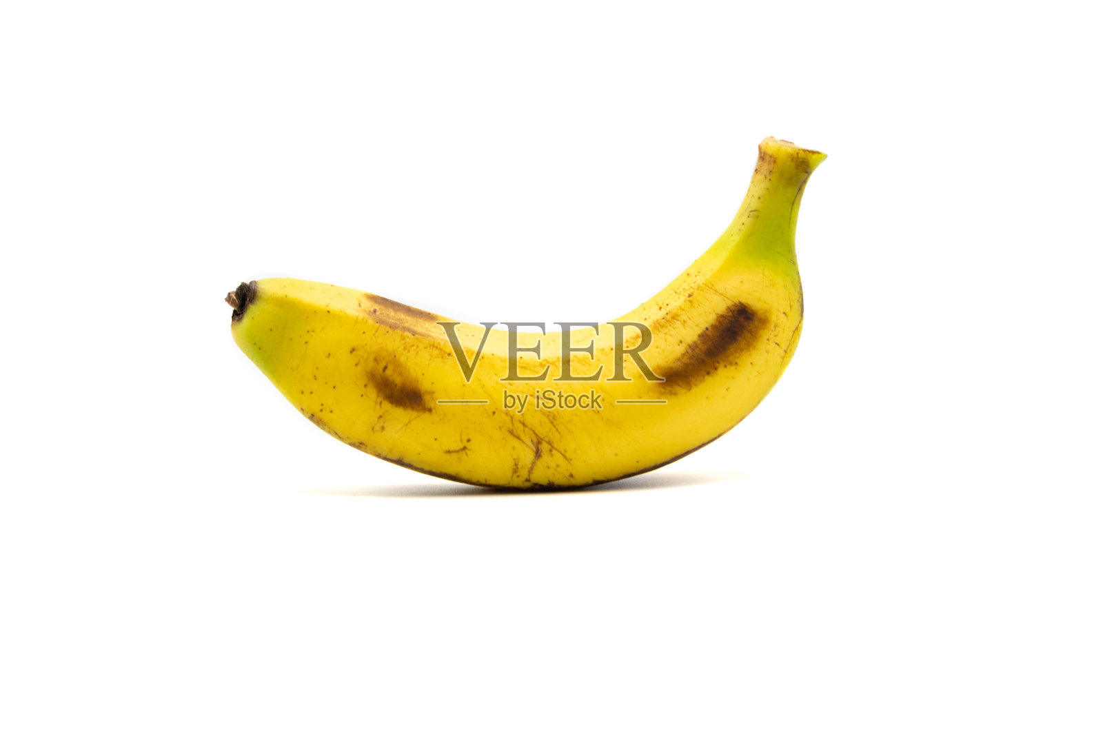 在白色背景上孤立的单根香蕉照片摄影图片