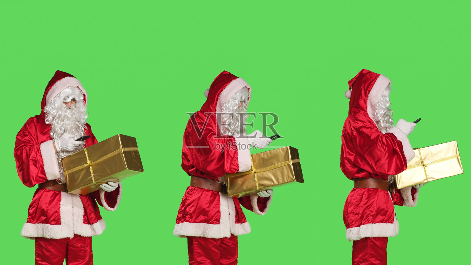 圣诞老人正在给礼物拍照照片摄影图片