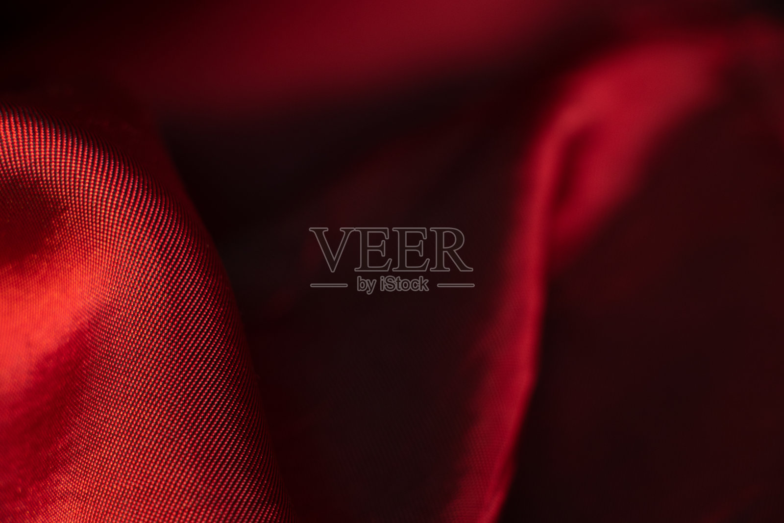 红色丝质波浪布作背景,红色照片摄影图片