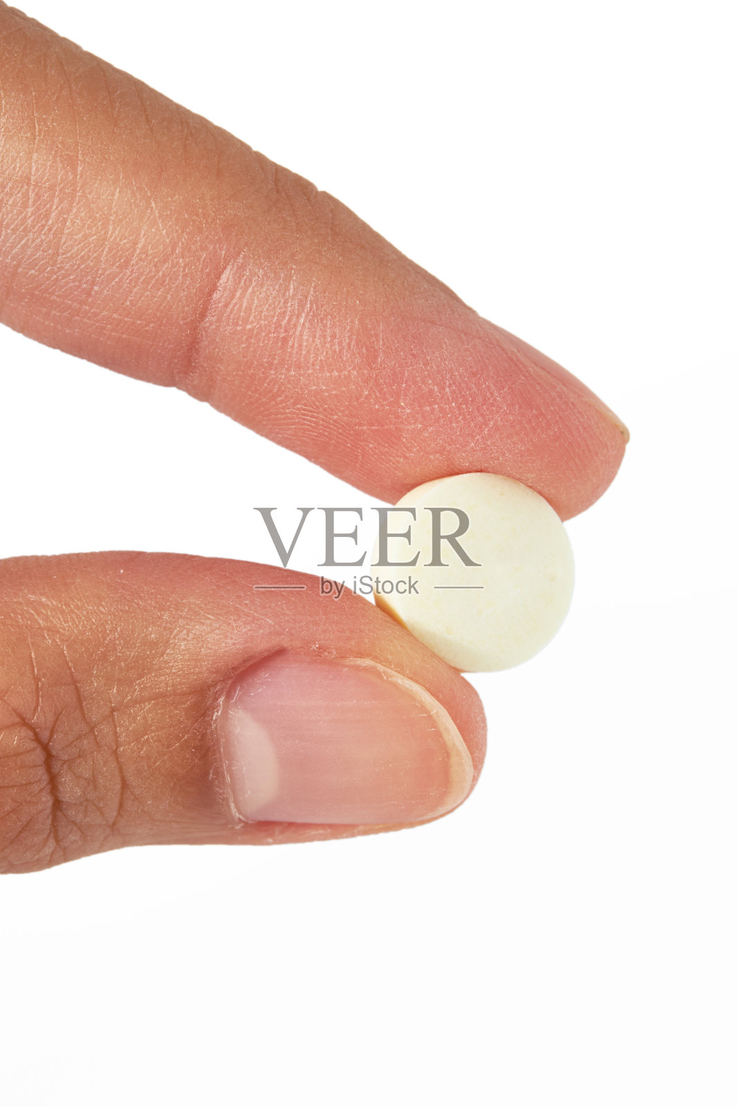 手持圆形白色药丸孤立在白色背景。照片摄影图片