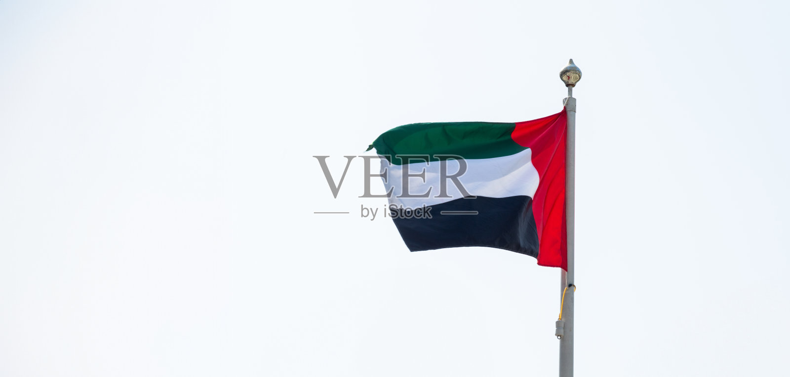 挥舞着阿联酋国旗照片摄影图片