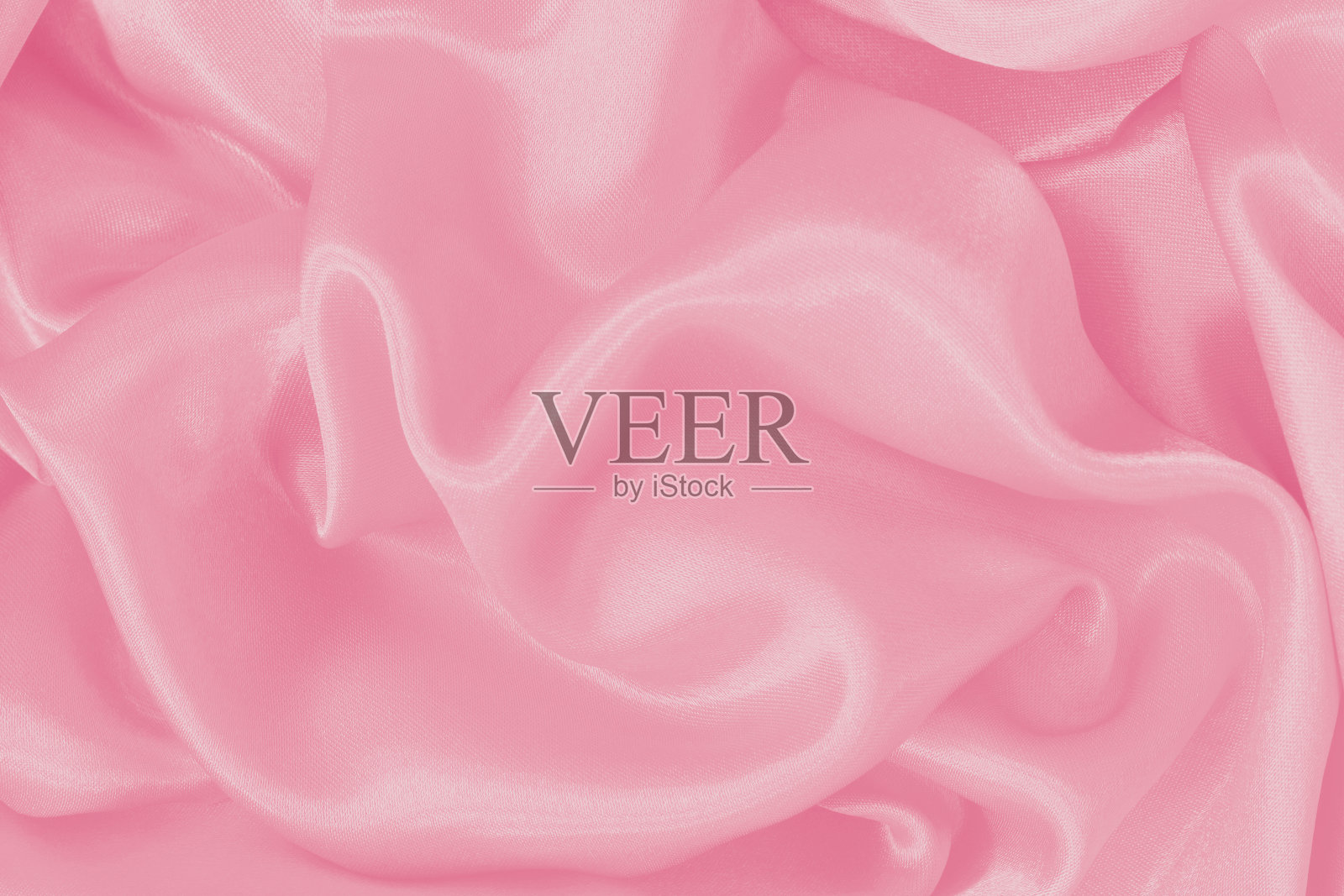 柔软的粉红色织物纹理背景,丝绸或亚麻图案的细节。照片摄影图片