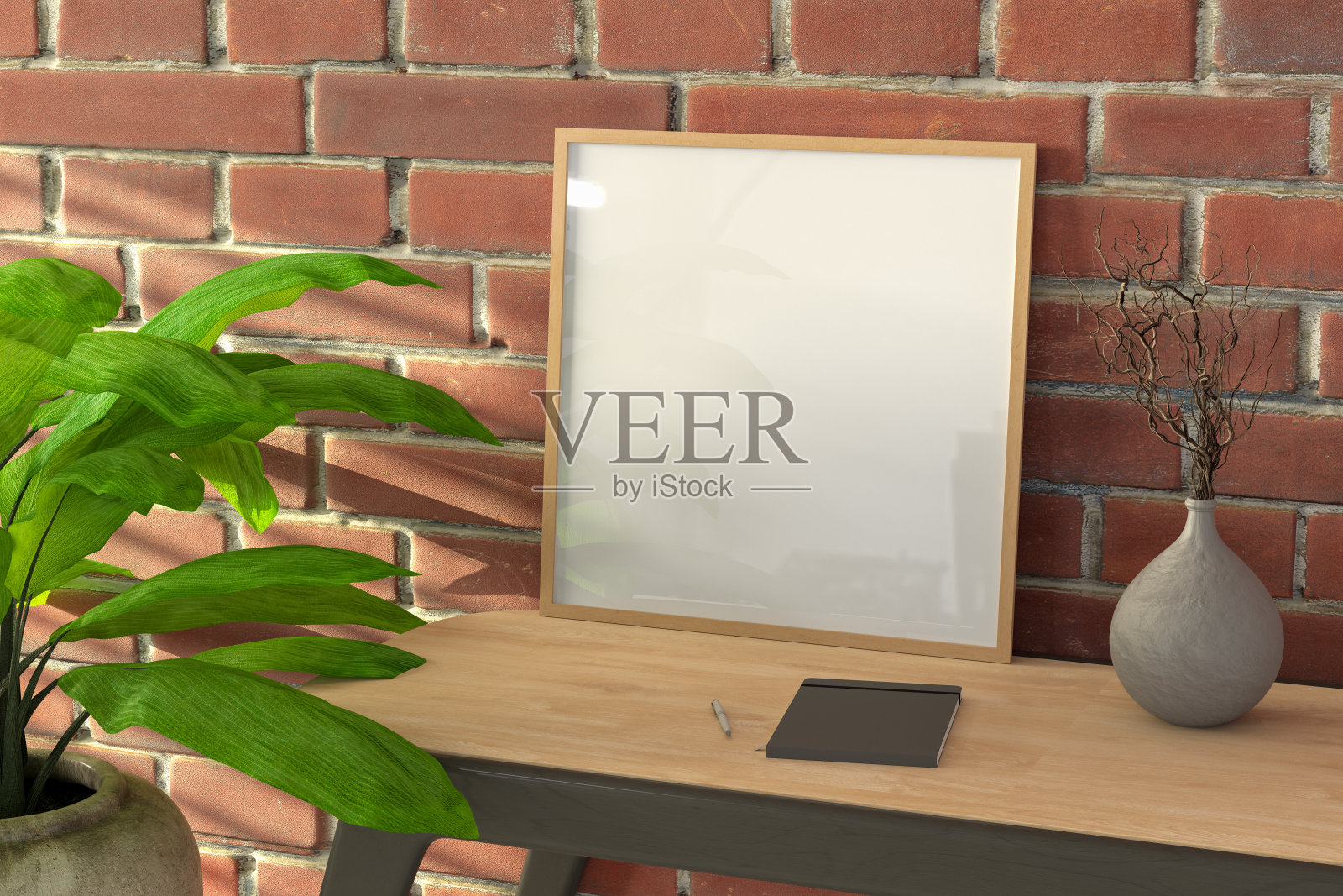 木制桌子和红色砖墙上的方形木制框架模型。照片摄影图片