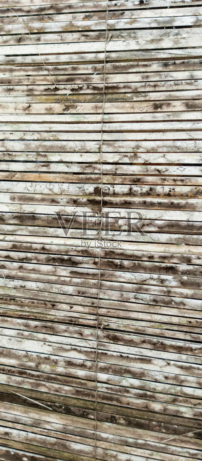 以竹为背景编织出质感的竹墙照片摄影图片