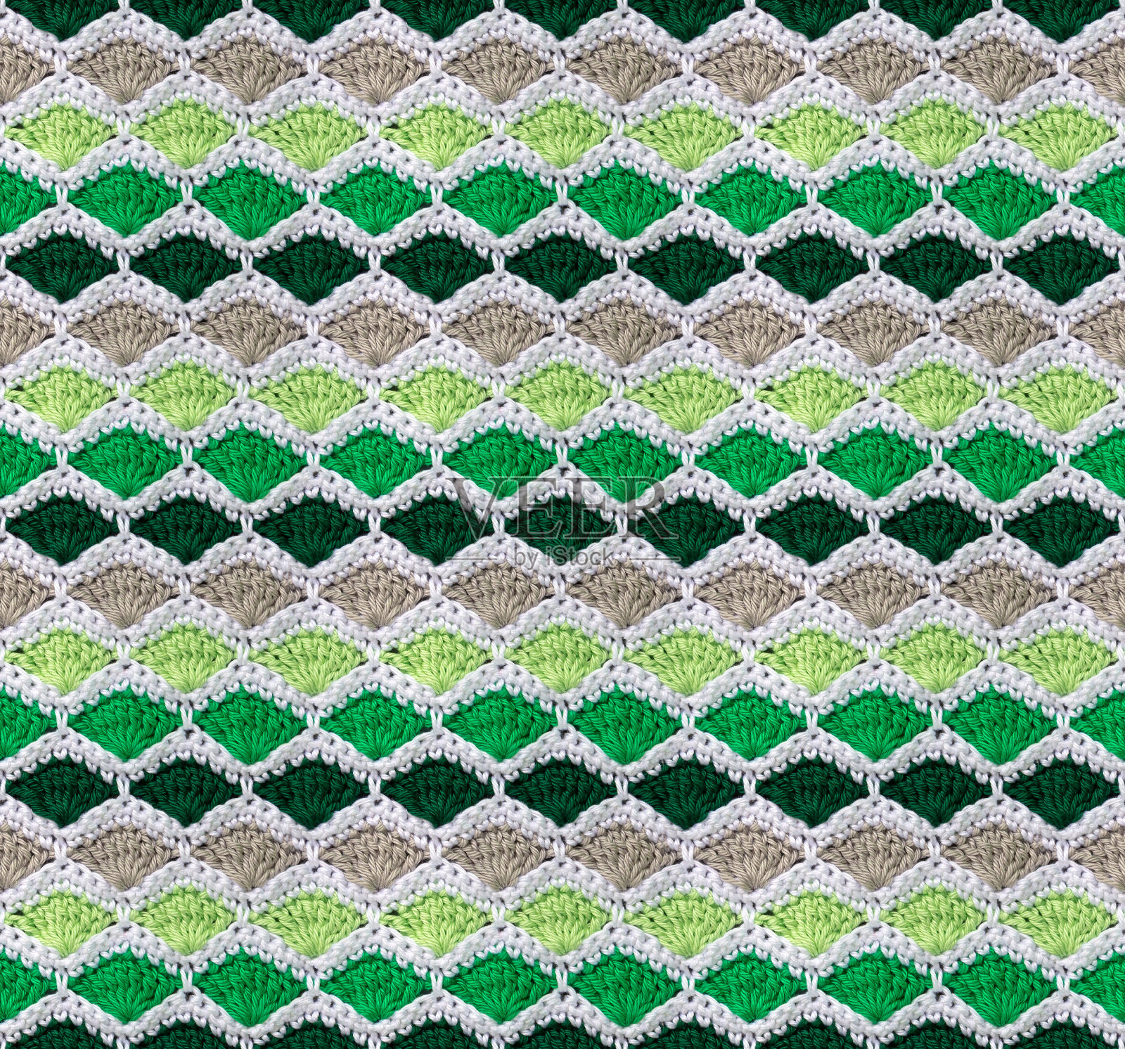 无缝针织质感。蜂窝状的图案是用彩色棉纱钩织而成的。照片摄影图片