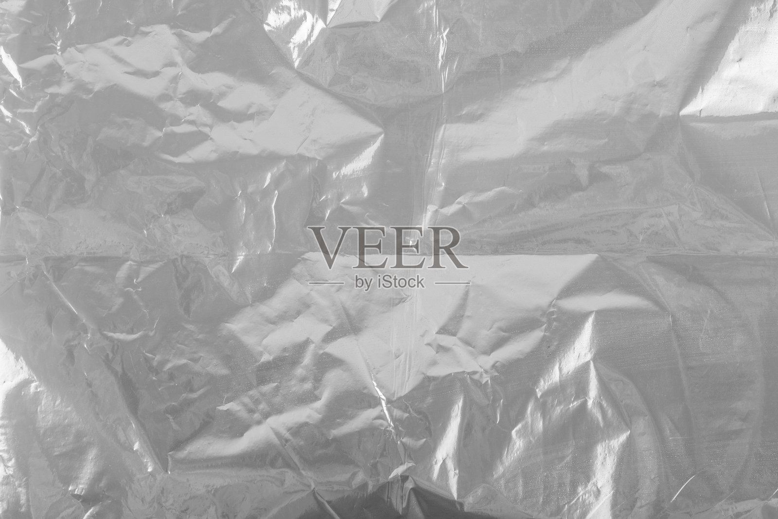 银色塑料箔背景。从纸上提取银色背景照片摄影图片