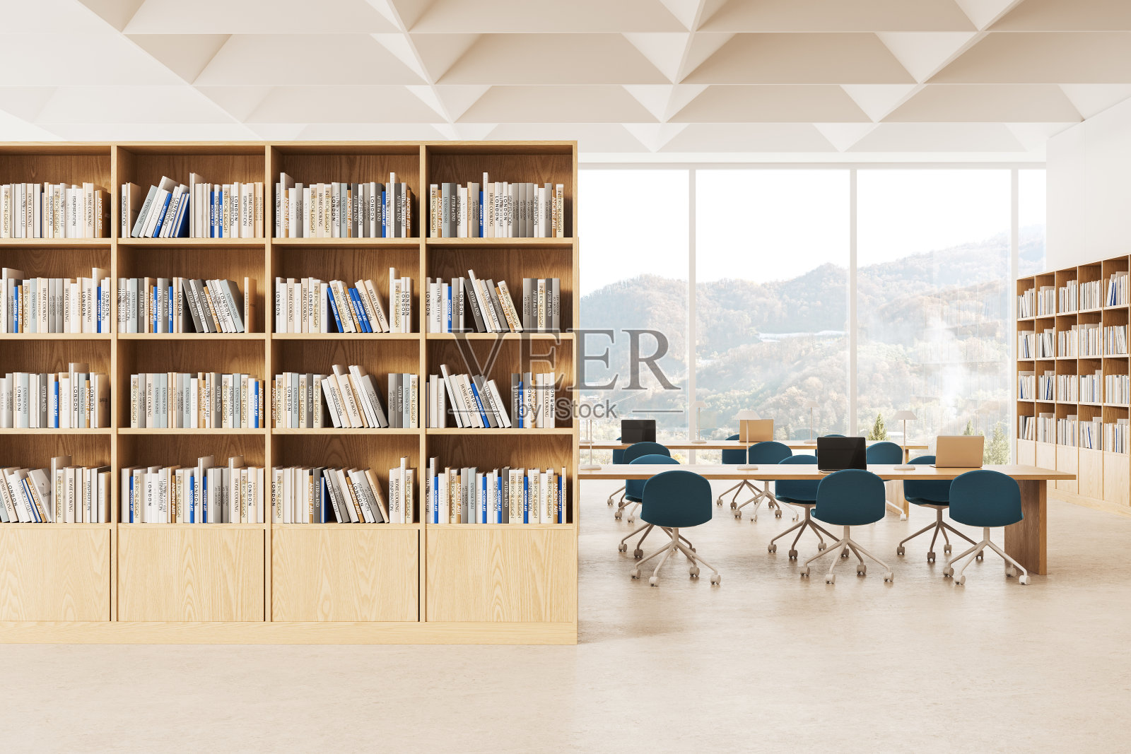 时尚的图书馆内部有书架和书桌,笔记本电脑,窗户照片摄影图片