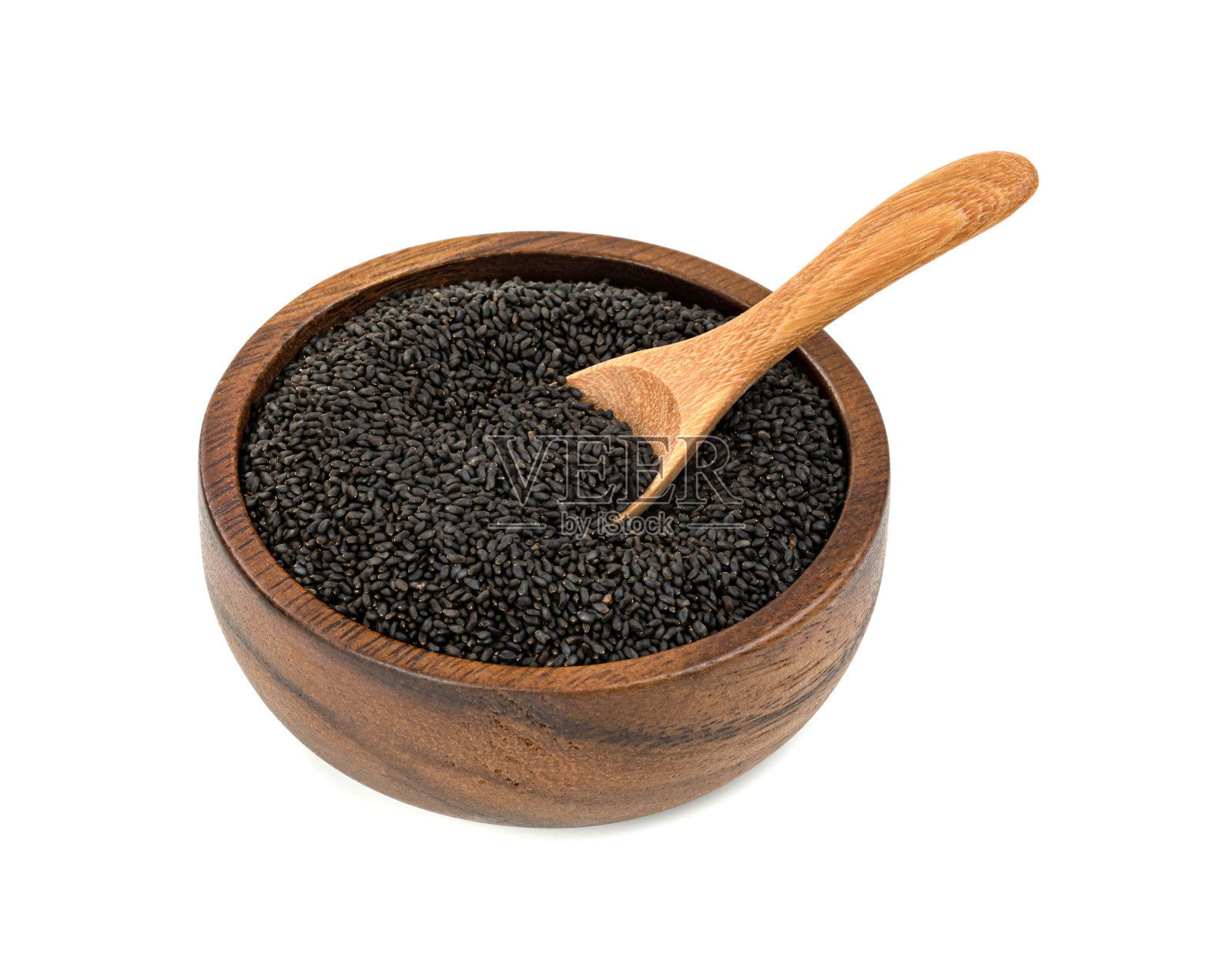 毛茸茸的罗勒种子与木碗和勺子隔离在白色背景照片摄影图片