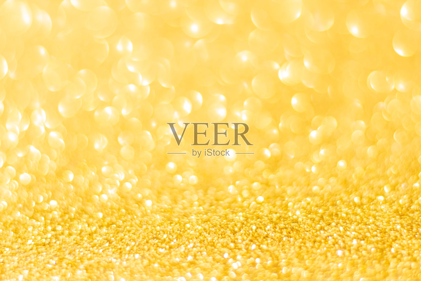 金色闪光散焦纹理背景。金色圣诞抽象背景照片摄影图片