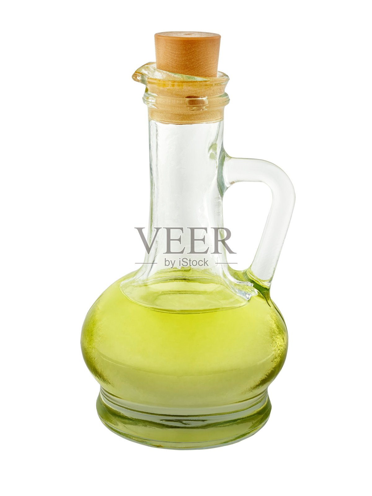 有把手的玻璃瓶,盛有新鲜橄榄油。照片摄影图片