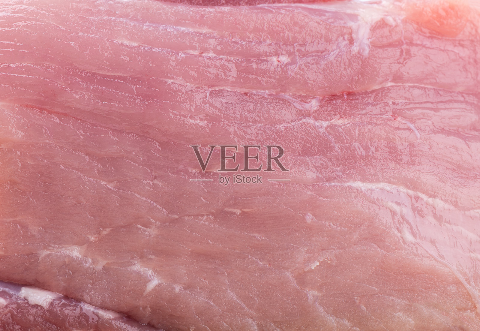 饱满的框架表面鲜嫩多汁的红肉。照片摄影图片